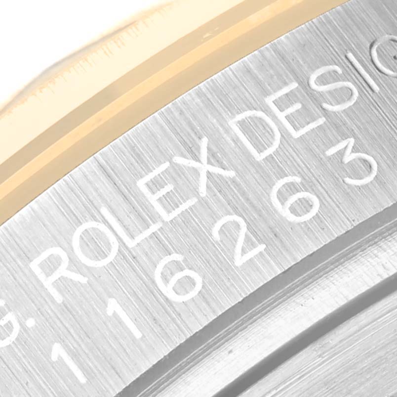 This image shows a close-up of the engraving on the side of a Rolex Turn-o-Graph 116263 Men
s Steel and Gold (two tone) White Dial 116263 Men
s Steel and Gold (two tone) White Dial watch case.