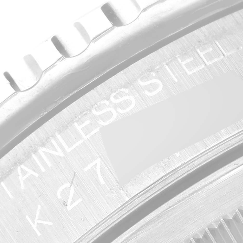 The image shows a close-up of the bezel and part of the case back inscription of a Rolex Turn-o-Graph 16264 Men
s Stainless Steel Blue Dial 16264 Men
s Stainless Steel Blue Dial watch.