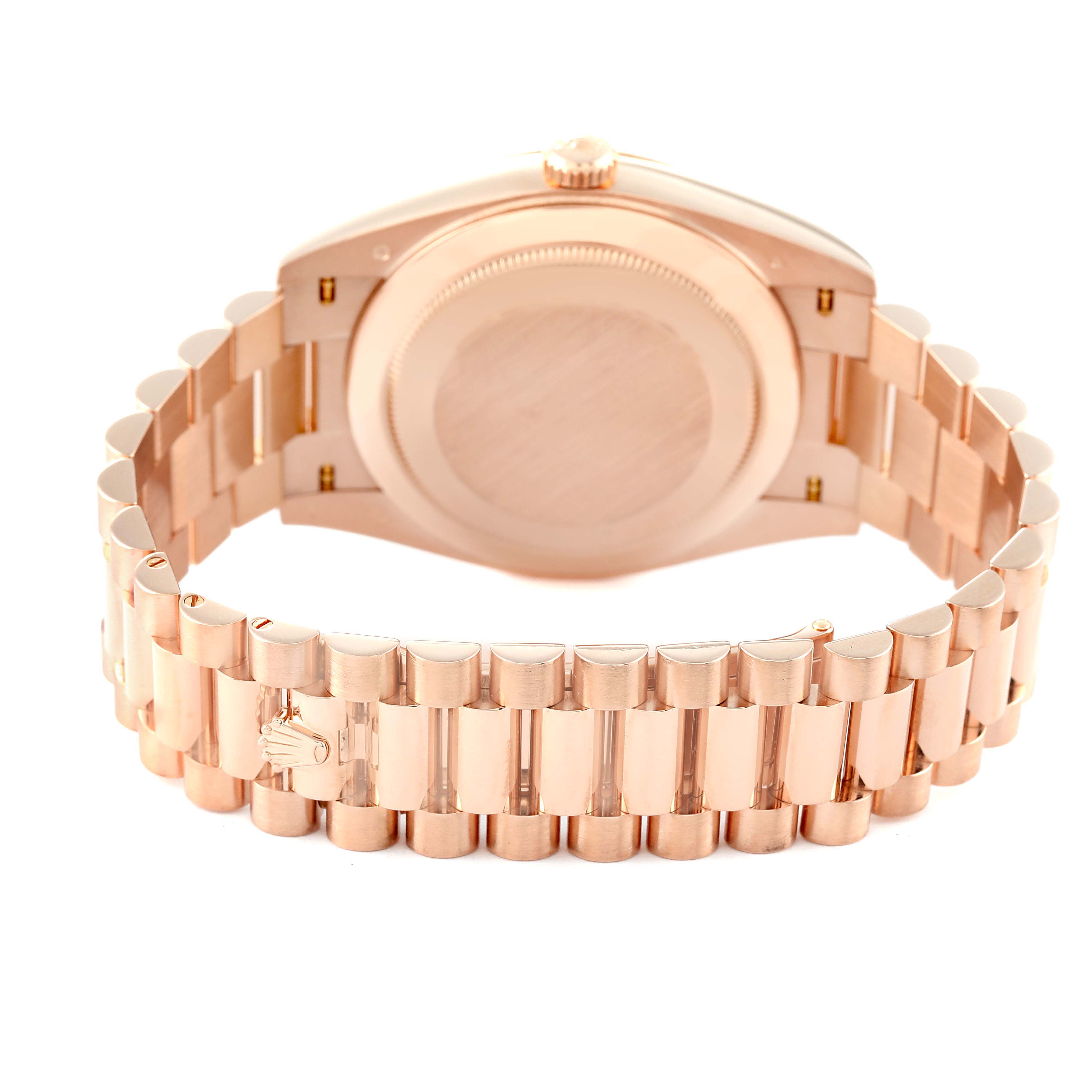The image shows the back view of the President model Rolex watch, highlighting its case back and bracelet.