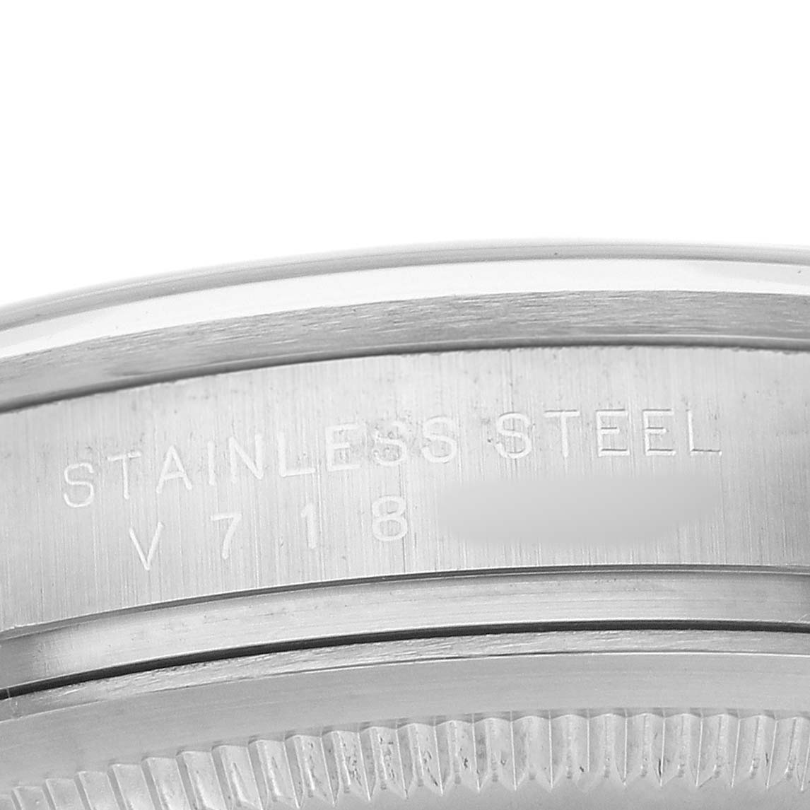 The image shows a close-up of the edge and case side of a Rolex Explorer 114270 Men's Stainless Steel Black Dial watch, highlighting its stainless steel material and engravings.