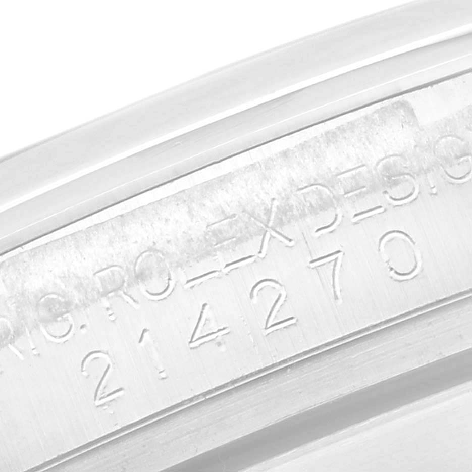 This close-up image shows the engraved inside of the bezel of a Rolex Explorer 214270 Men's Stainless Steel Black Dial 214270 Men's Stainless Steel Black Dial watch, highlighting the model number.