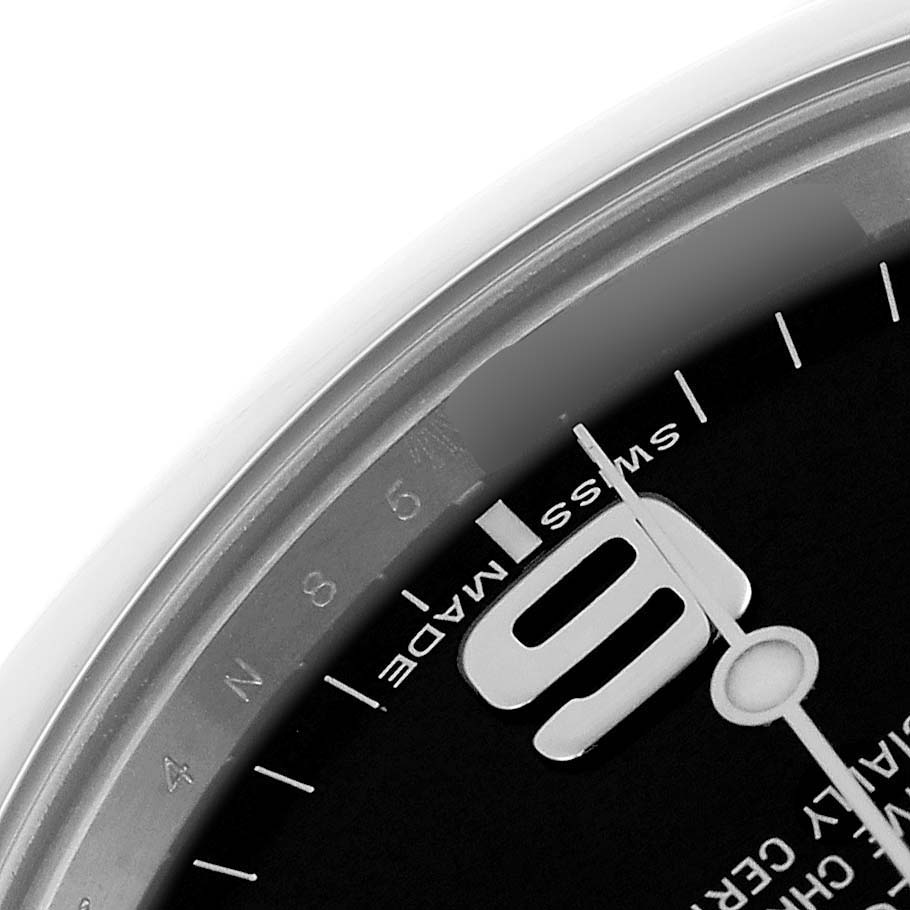 The image shows a close-up of the dial of a Rolex Explorer 214270 Men's Stainless Steel Black Dial 214270 Men's Stainless Steel Black Dial watch, highlighting the 9 o'clock numeral and "Swiss Made" text.