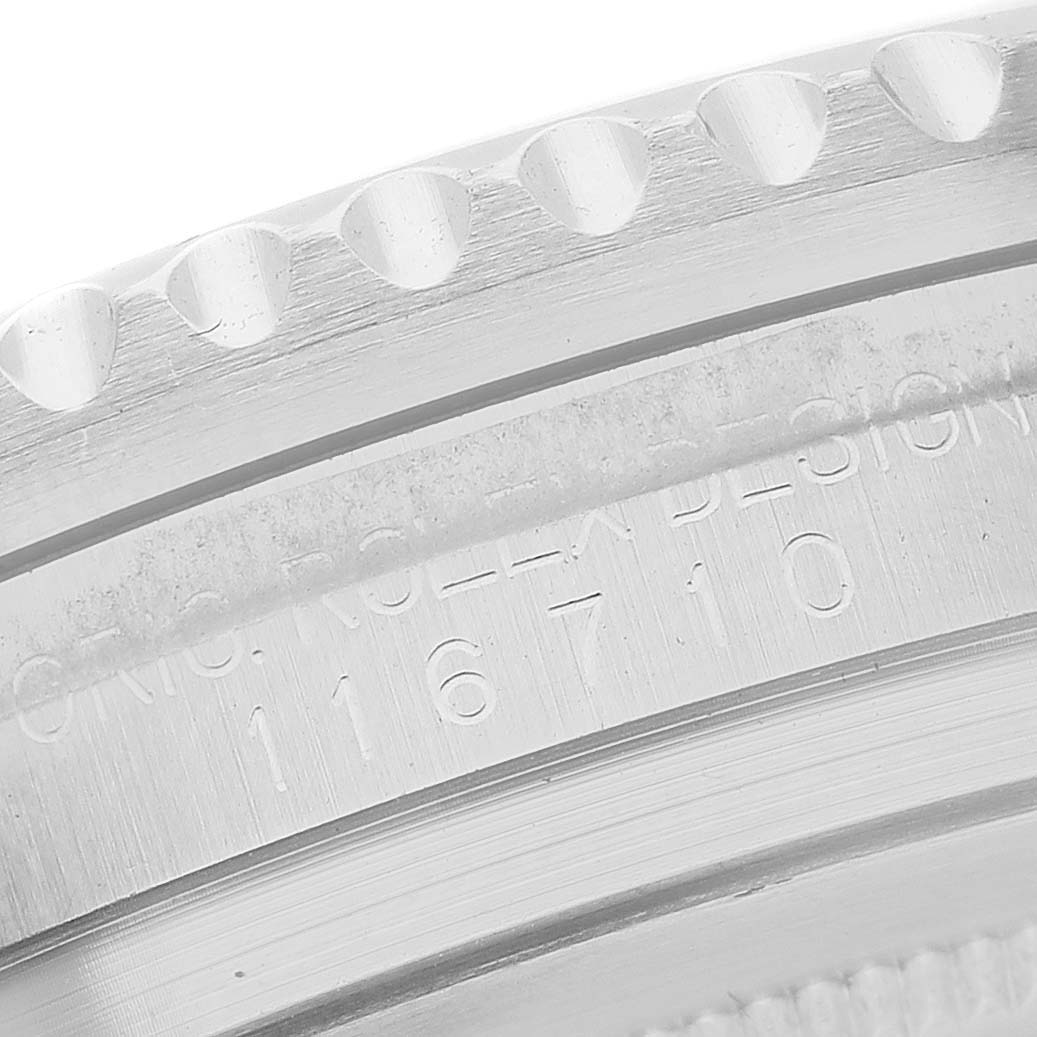 The image shows a close-up of the Rolex GMT-Master 116710LN Men's Stainless Steel Black Dial watch case, highlighting the engraved serial number.