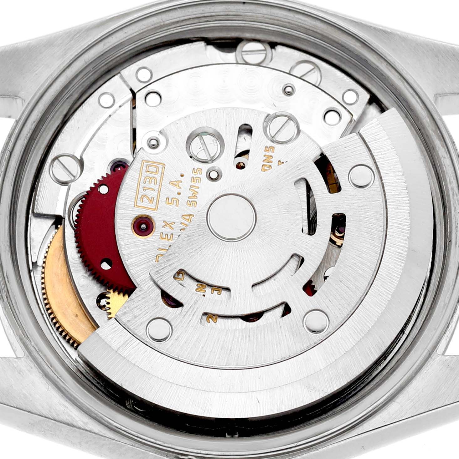 The image shows the movement mechanism of a Rolex Oyster Perpetual 67230 Women's Stainless Steel Silver Dial watch from a back view, highlighting gears and the rotor.