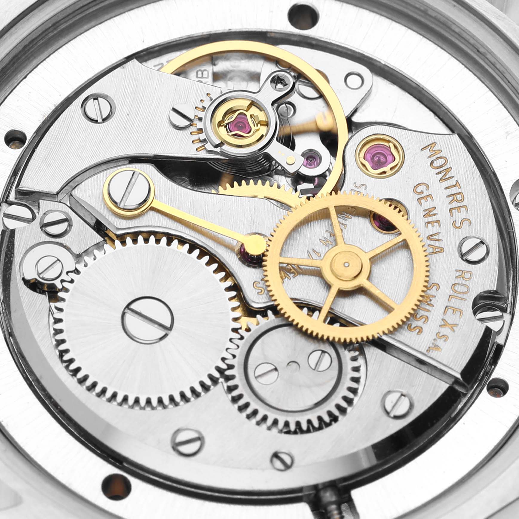 This image shows the intricate movement mechanics of a Rolex Vintage Collection 6694 Men's Stainless Steel Silver Dial 6694 Men's Stainless Steel Silver Dial model, revealing gears and cogs.