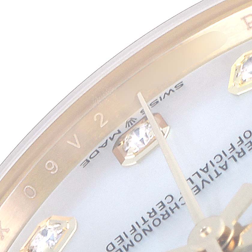 This close-up of a Rolex President 278288 Women's Yellow Gold Mother of Pearl Dial 278288 Women's Yellow Gold Mother of Pearl Dial model watch shows part of the dial, diamond markers, and a "Swiss Made" inscription.