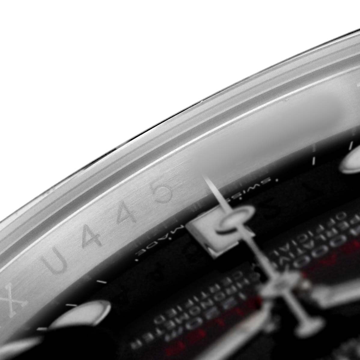 The image shows a close-up of the bezel and dial of a Rolex Sea-Dweller 126600 Men's Stainless Steel Black Dial, focusing on part of the outer rim and the watch hands.