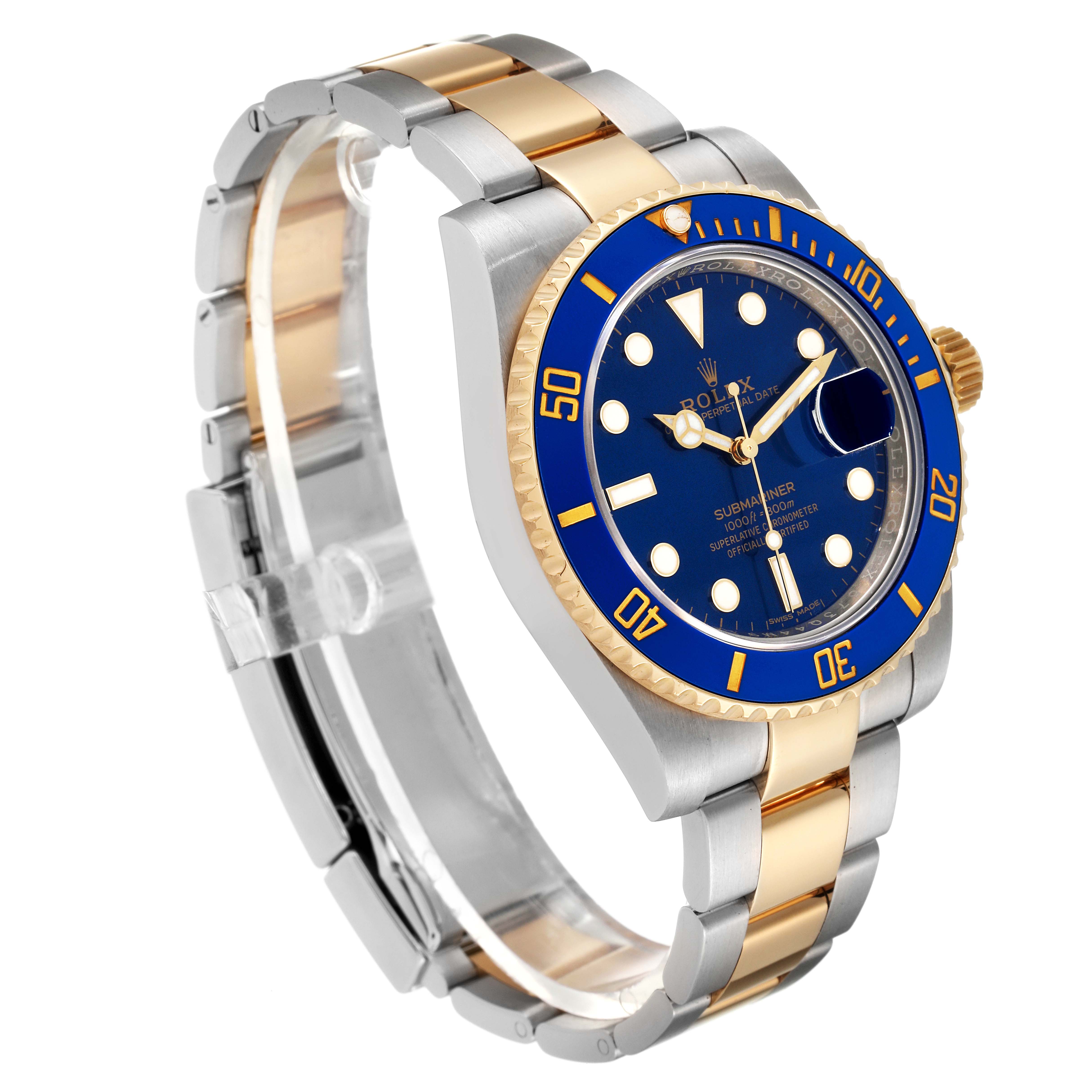 The image shows a Rolex Submariner 116613 Men's Steel and Gold (two tone) Blue Dial 116613 Men's Steel and Gold (two tone) Blue Dial watch at an angle, highlighting its blue dial, bezel, and two-tone metal bracelet.