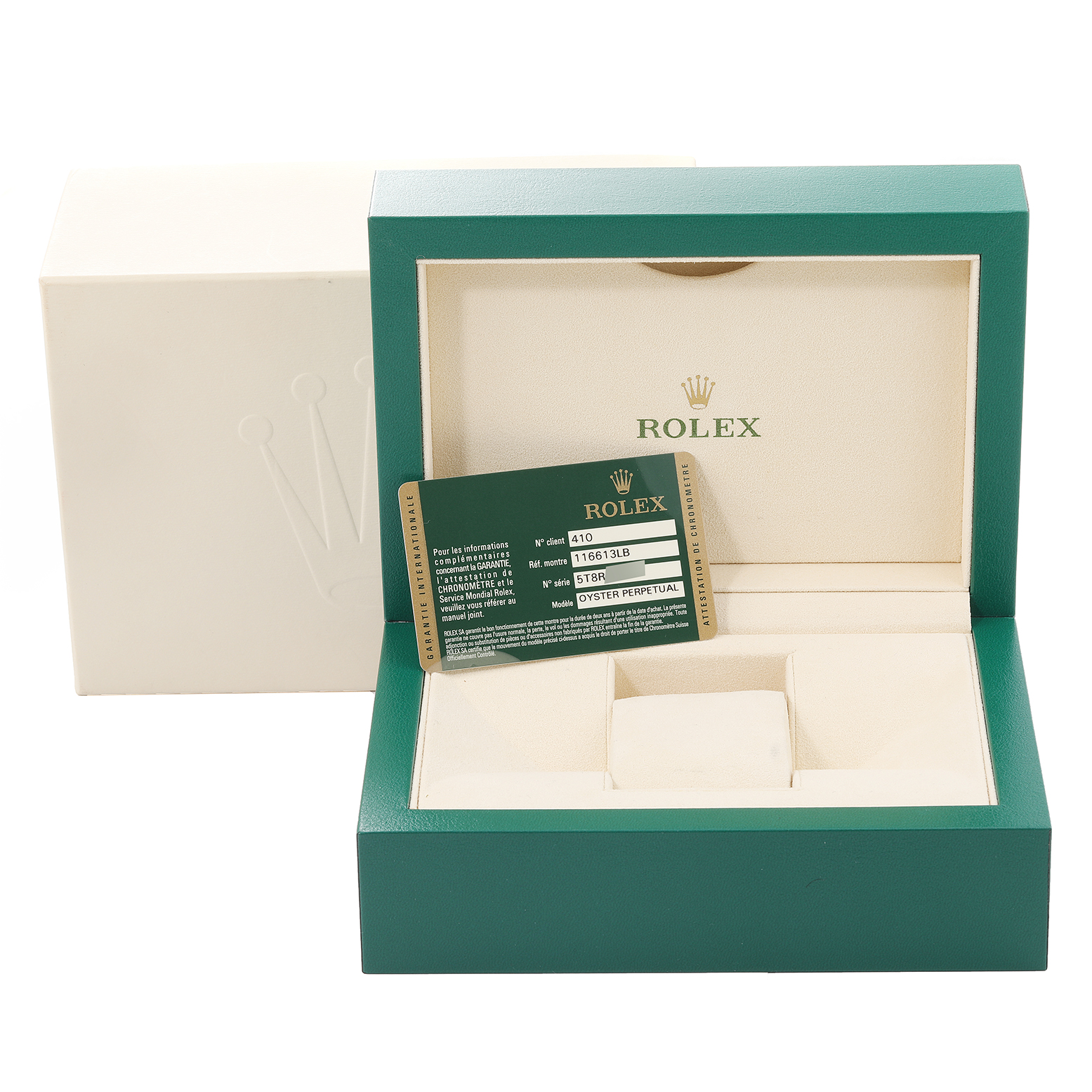 The image shows an open green Rolex watch box with a Submariner model warranty card placed inside.