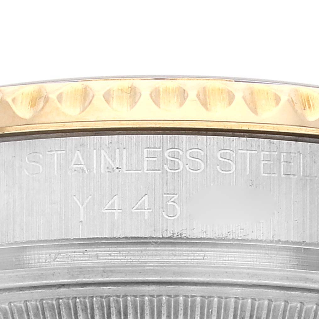 The image shows a close-up of the stainless steel portion and the bezel of a Rolex Yacht-Master 168623 Men
s Steel and Gold (two tone) White Dial 168623 Men
s Steel and Gold (two tone) White Dial watch.