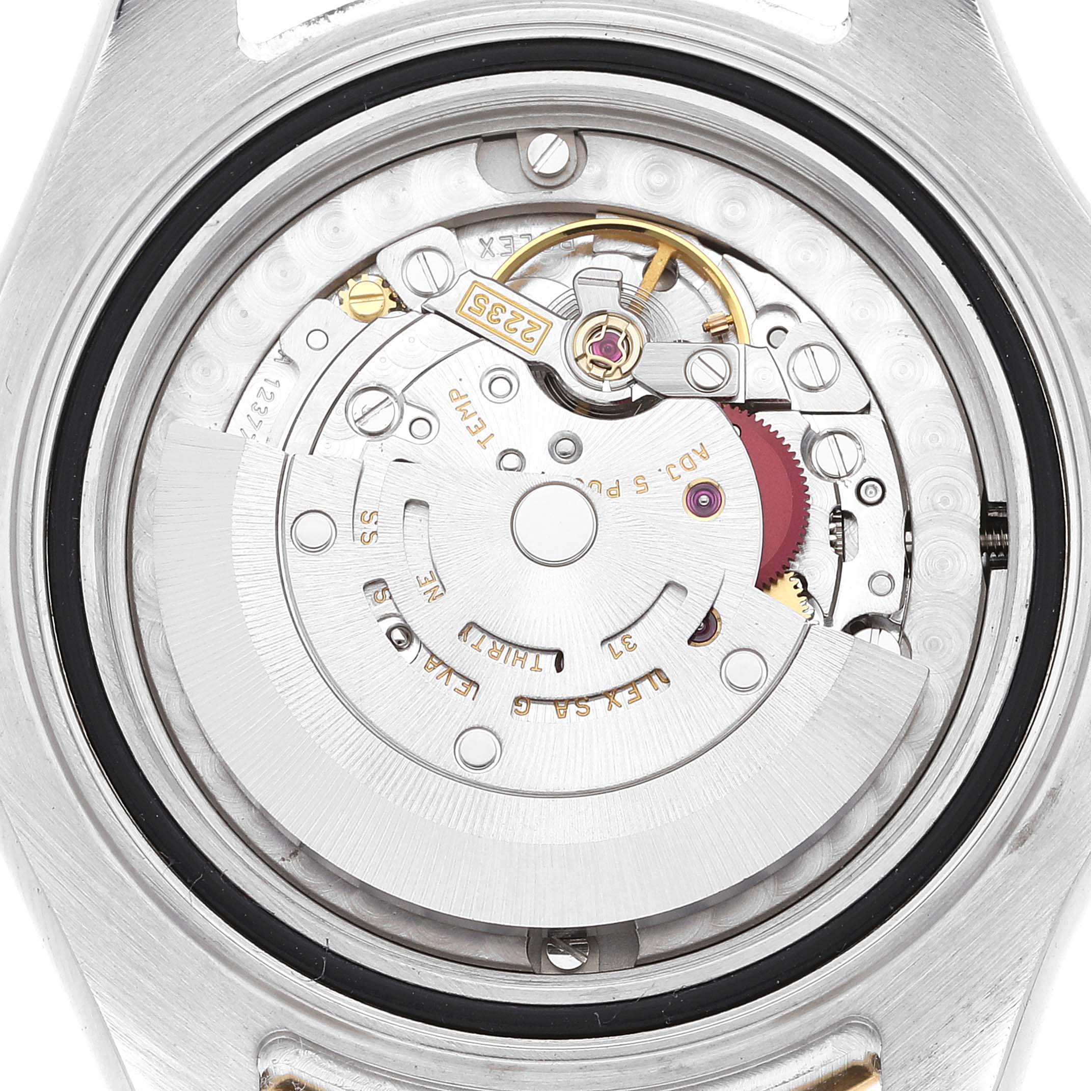 This is an image showing the intricate internal mechanism of a Rolex Yacht-Master 168623 Men
s Steel and Gold (two tone) White Dial 168623 Men
s Steel and Gold (two tone) White Dial watch from a rear angle.