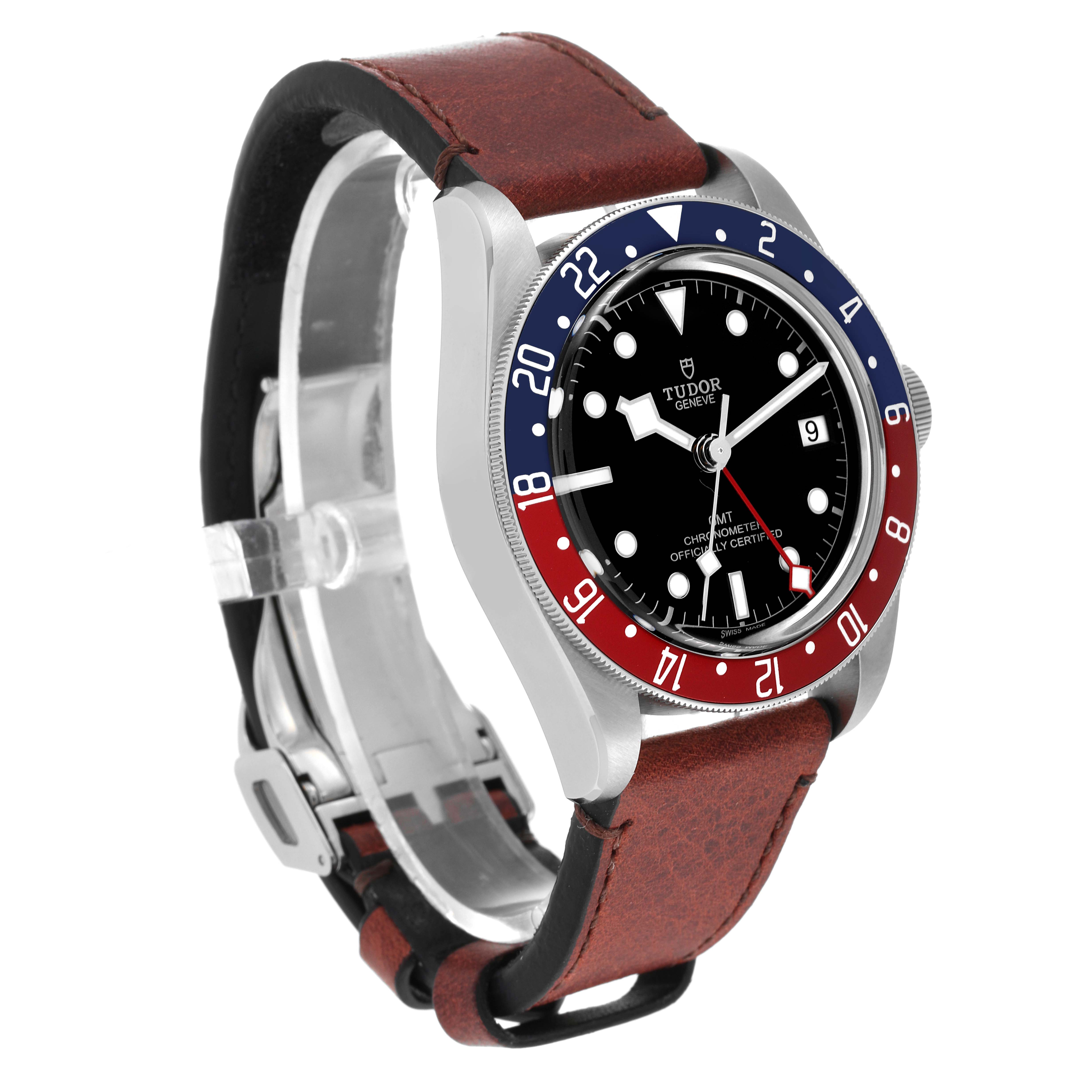 The image shows a Tudor Heritage Black Bay 79830RB Men
s Stainless Steel Black Dial 79830RB Men
s Stainless Steel Black Dial watch from an angle displaying its face, bezel, and brown leather strap.