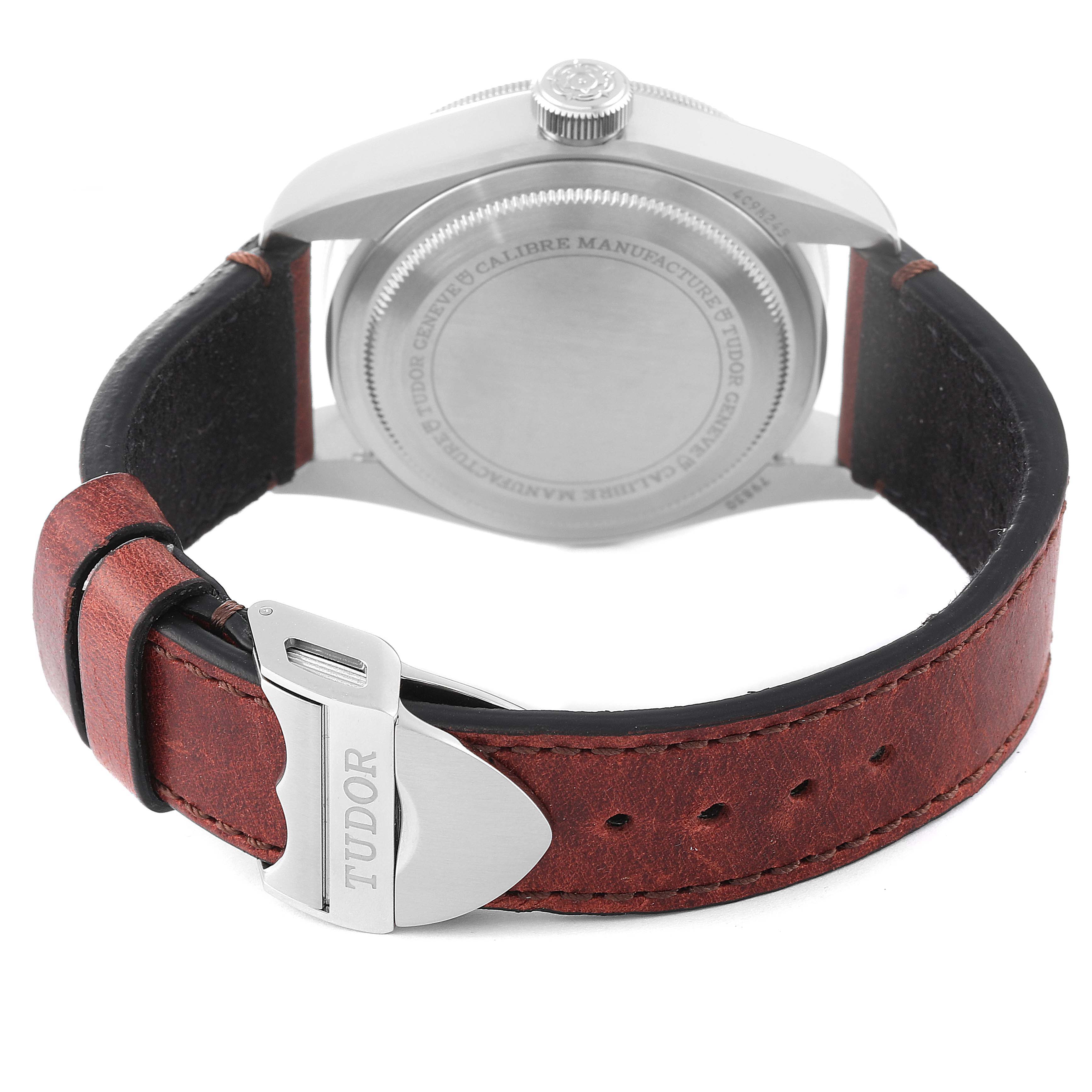 This image shows the backside and clasp of a Tudor Heritage Black Bay 79830RB Men
s Stainless Steel Black Dial 79830RB Men
s Stainless Steel Black Dial watch, focusing on the case back and leather strap.