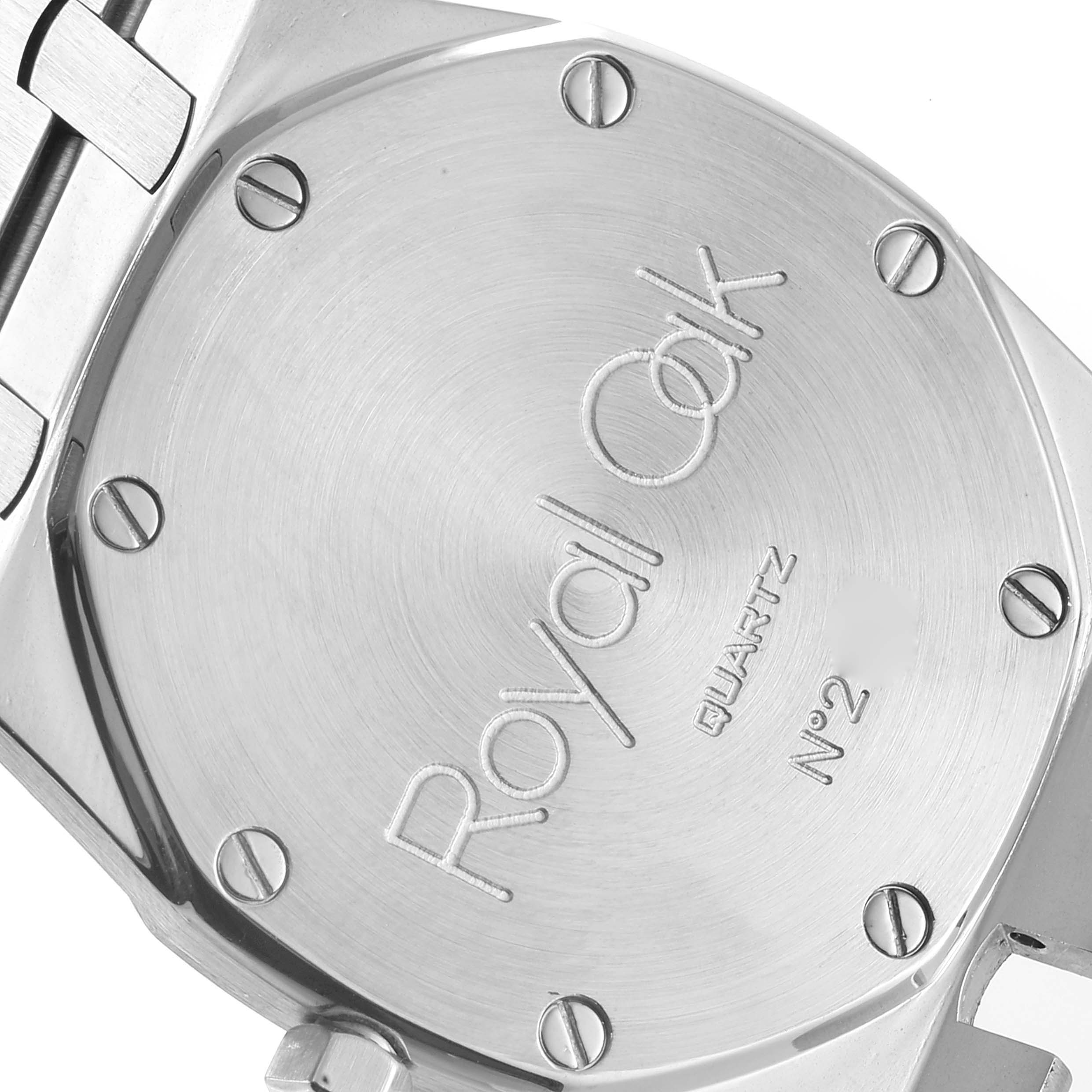 The image shows the case back of a Royal Oak model by Audemars Piguet, featuring its engravings and screws.