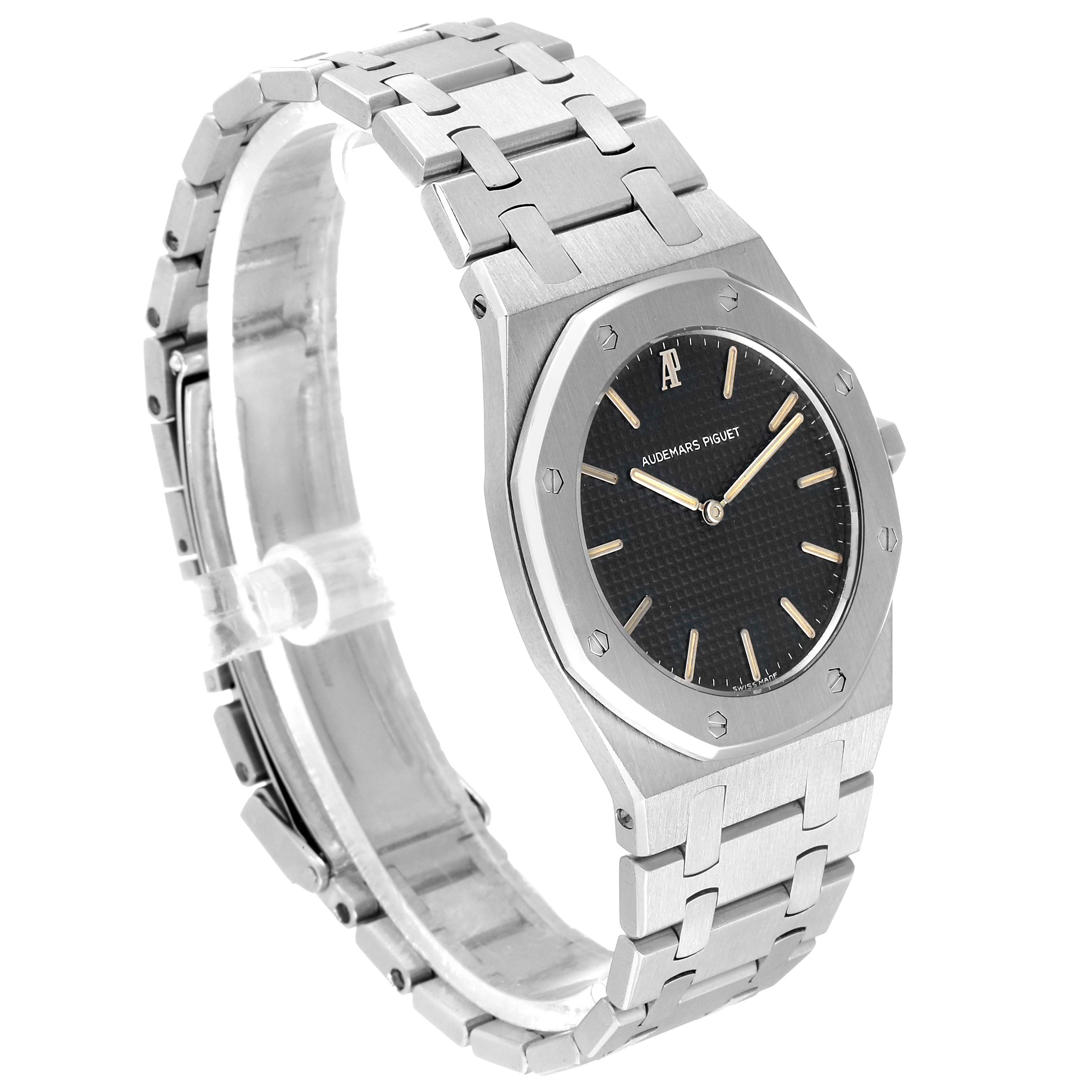 The image shows a side angle of the Audemars Piguet Royal Oak 56303ST.OO.0789ST Men's Stainless Steel Black Dial 56303ST.OO.0789ST Men's Stainless Steel Black Dial watch, highlighting its black dial, octagonal bezel, and metal bracelet.