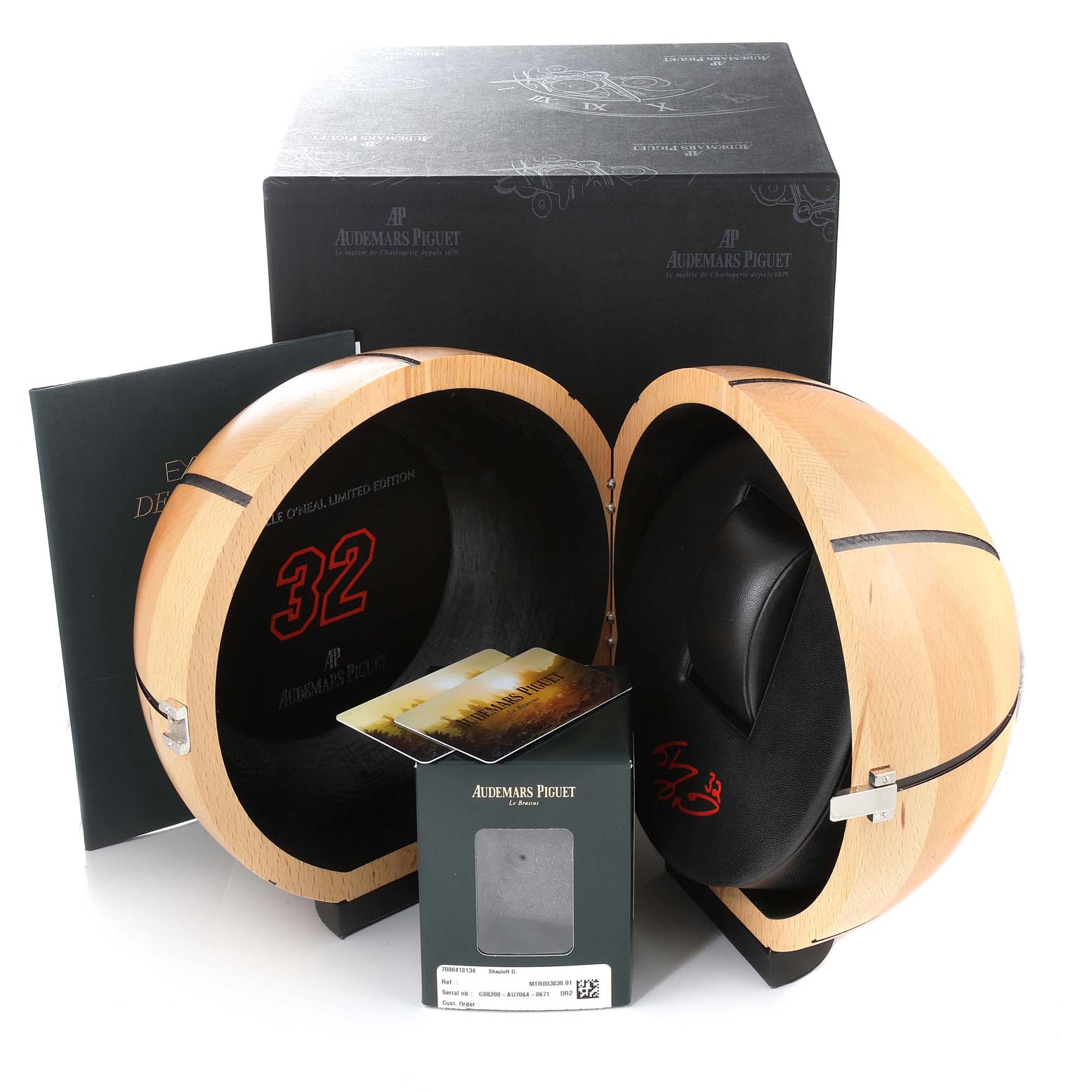 The image shows the Audemars Piguet Royal Oak Offshore 26133ST.OO.A101CR.01 Men's Stainless Steel Black Dial 26133ST.OO.A101CR.01 Men's Stainless Steel Black Dial packaging, including a spherical wooden box and documentation.