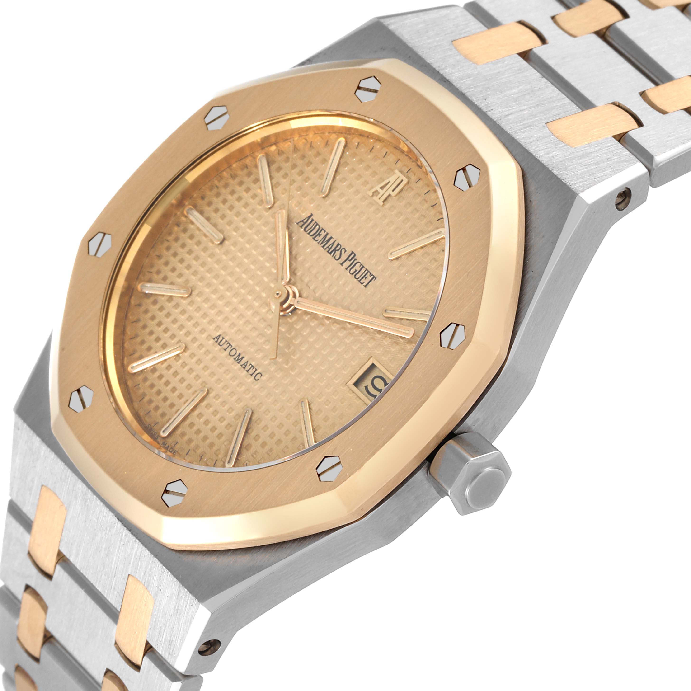 The image shows a close-up of the Audemars Piguet Royal Oak 4790/789 Men's Steel and Gold (two tone) Champagne Dial 4790/789 Men's Steel and Gold (two tone) Champagne Dial watch at an angle, focusing on the bezel, dial, and part of the bracelet.