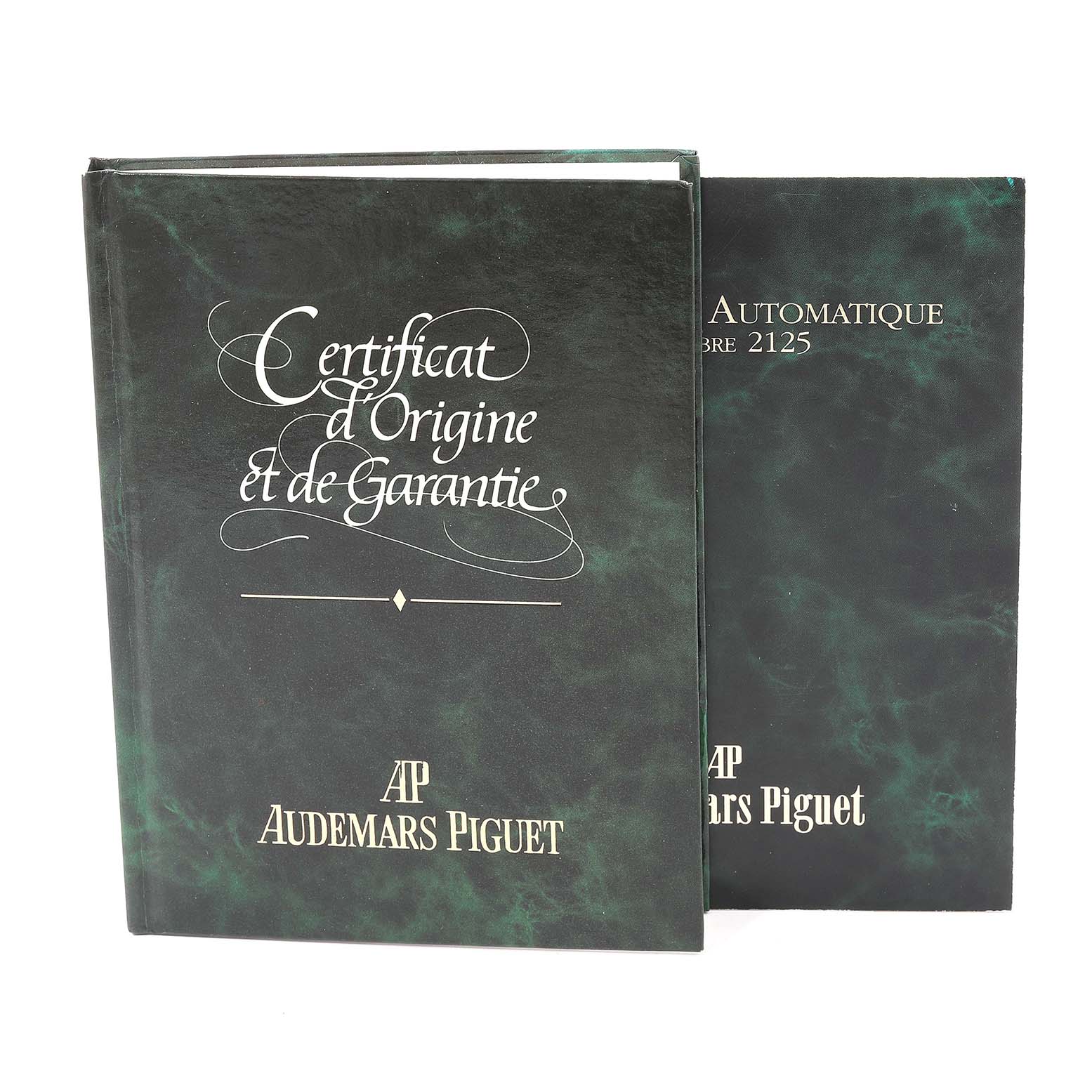 The image shows the warranty and certificate booklets for the Royal Oak model by Audemars Piguet.