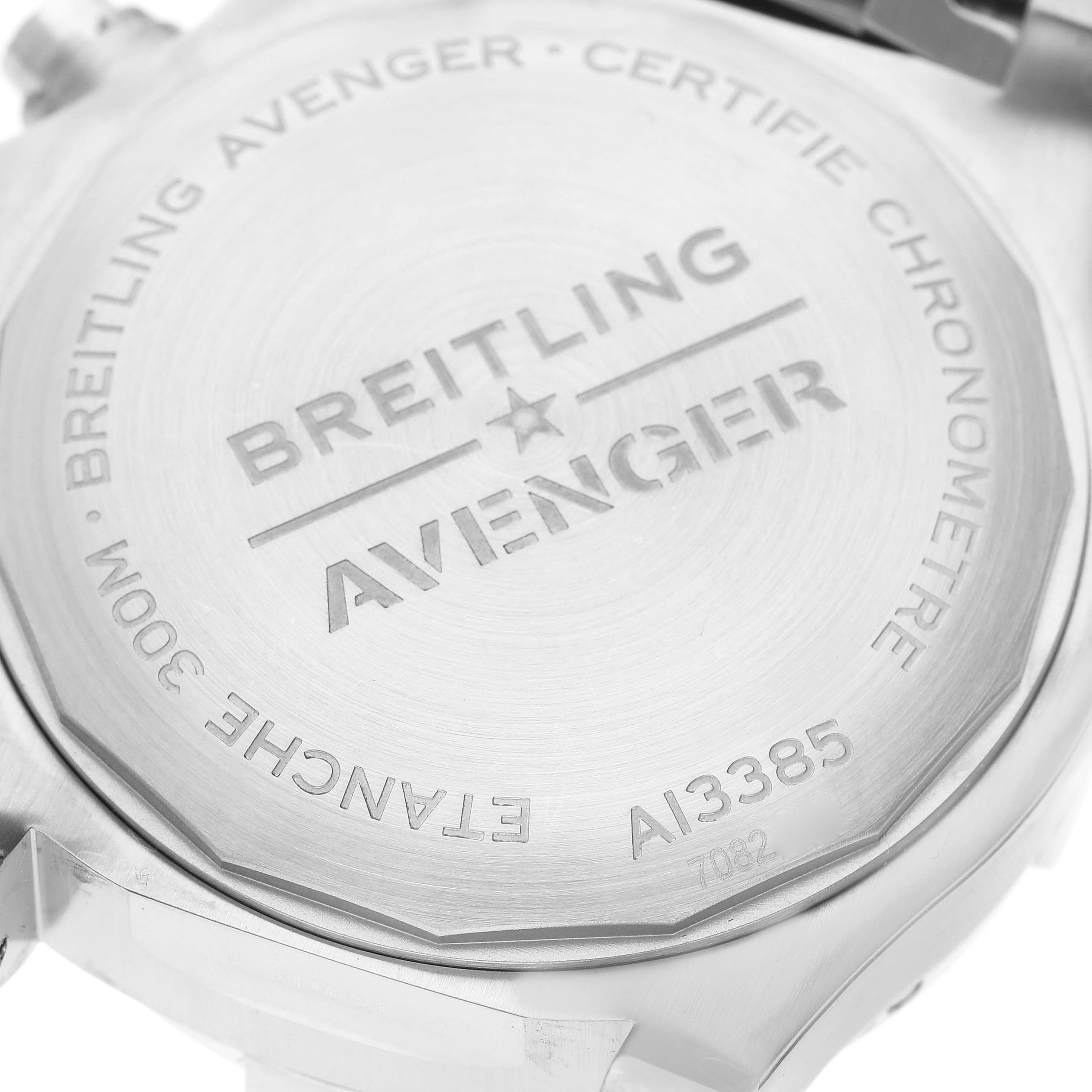 The image shows the back case of a Breitling Avenger A13385 Men's Stainless Steel Blue Dial A13385 Men's Stainless Steel Blue Dial watch, displaying the brand, model, and various specifications.