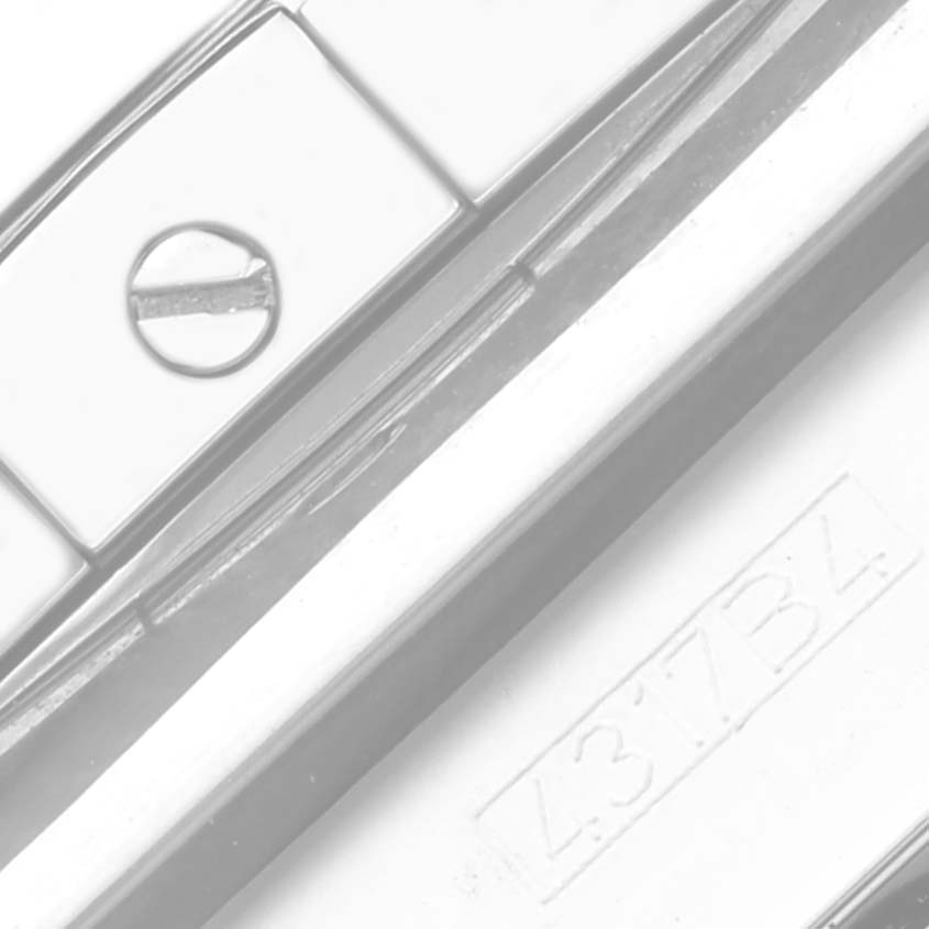 The image shows a close-up of a Breitling Chronomat AB011511/F577 Men's Stainless Steel Grey Dial AB011511/F577 Men's Stainless Steel Grey Dial watch clasp with a visible screw and part number.