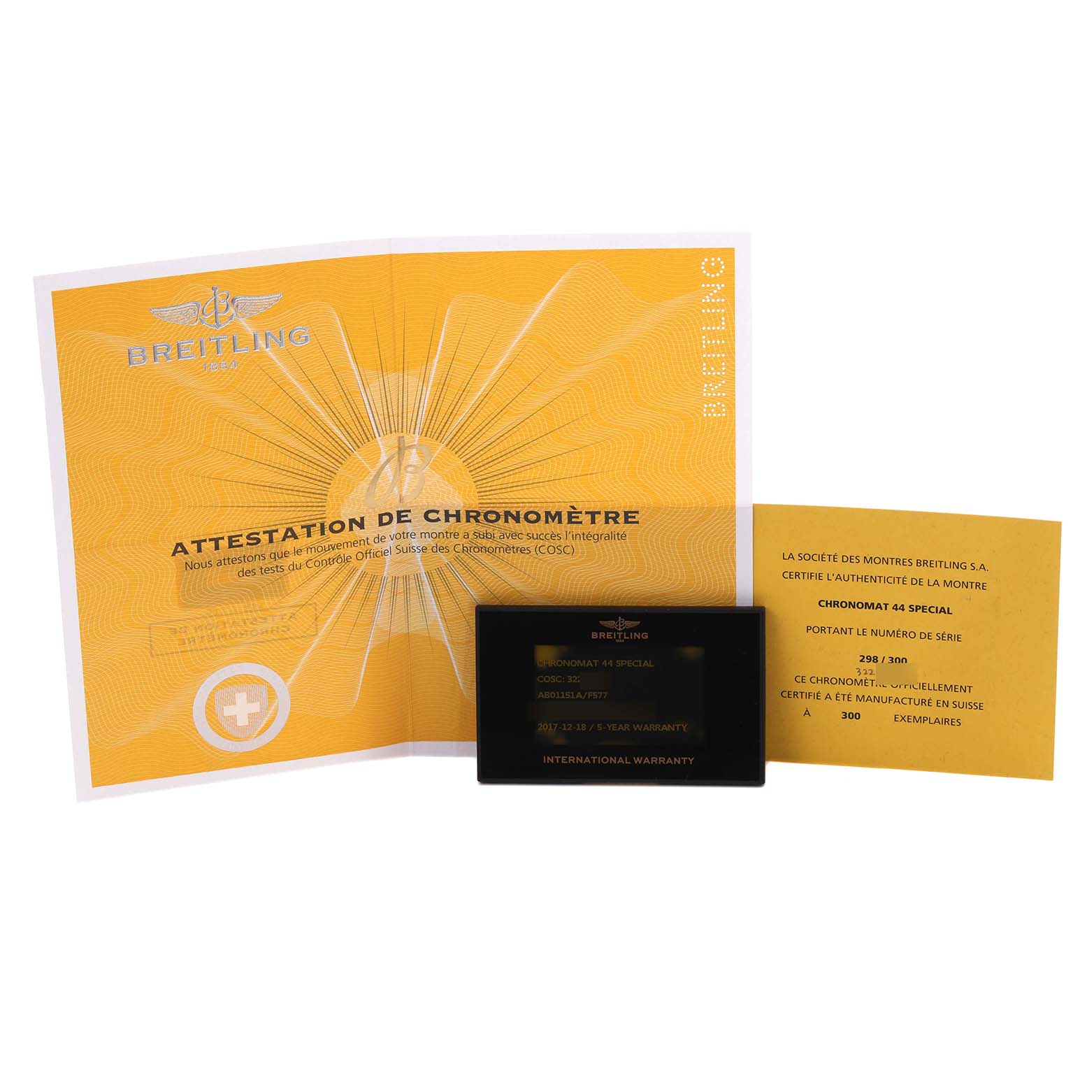 The image shows Breitling Chronomat AB011511/F577 Men's Stainless Steel Grey Dial AB011511/F577 Men's Stainless Steel Grey Dial watch documents, including a certificate and warranty card, displayed from above.