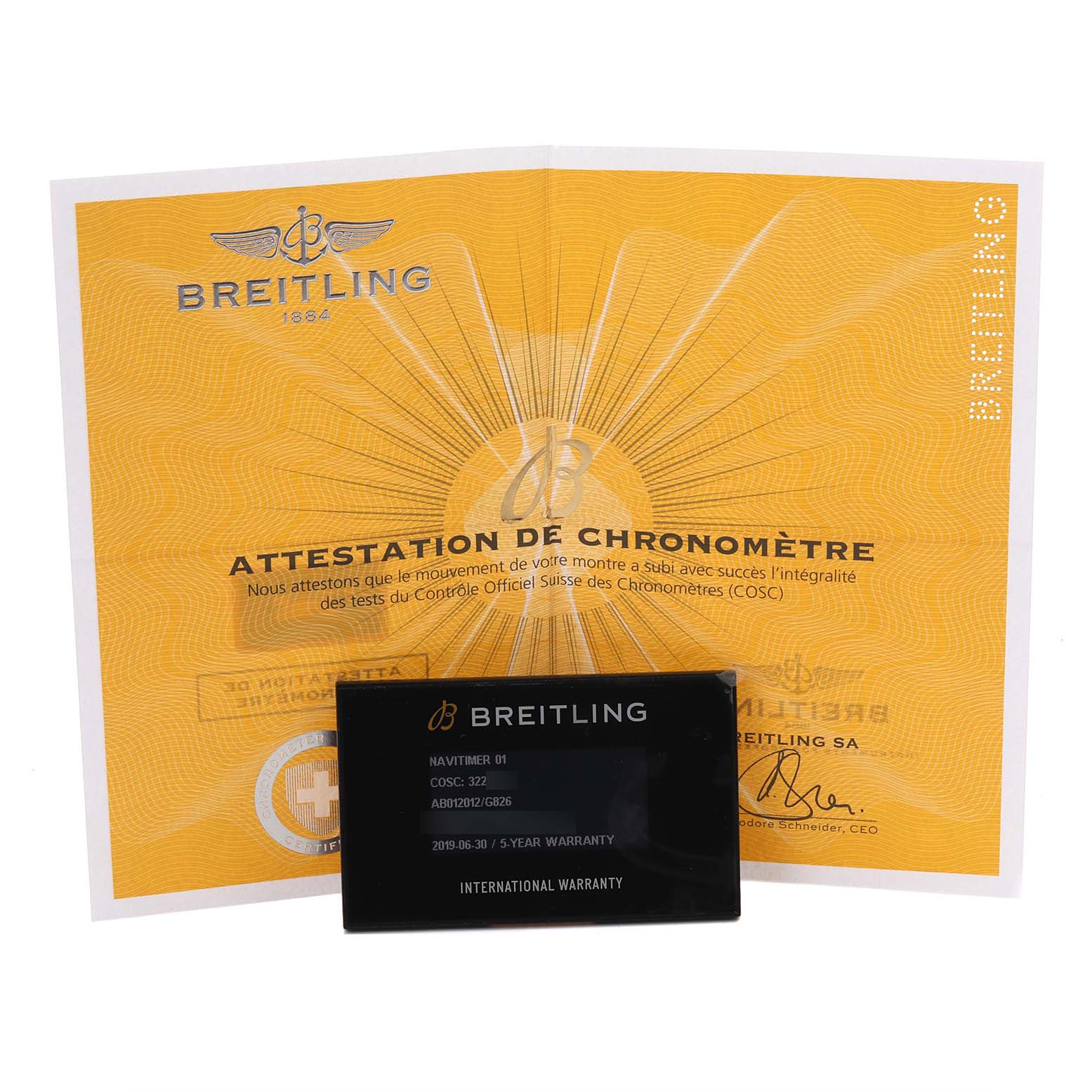 The image shows a Breitling Navitimer AB012012/G826 Men's Stainless Steel Silver Dial AB012012/G826 Men's Stainless Steel Silver Dial warranty card and a chronometer attestation certificate placed together, viewed from the front.