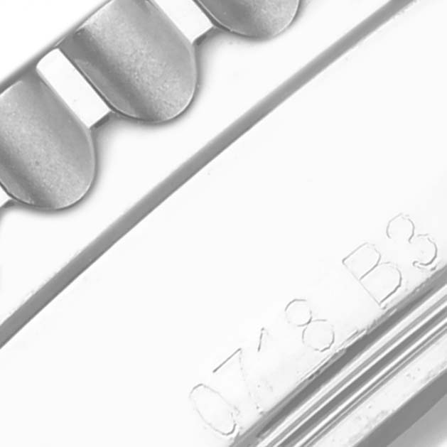 The image shows a close-up of the bracelet and part of the clasp with engraved details from a Breitling Navitimer AB012012/G826 Men's Stainless Steel Silver Dial AB012012/G826 Men's Stainless Steel Silver Dial.