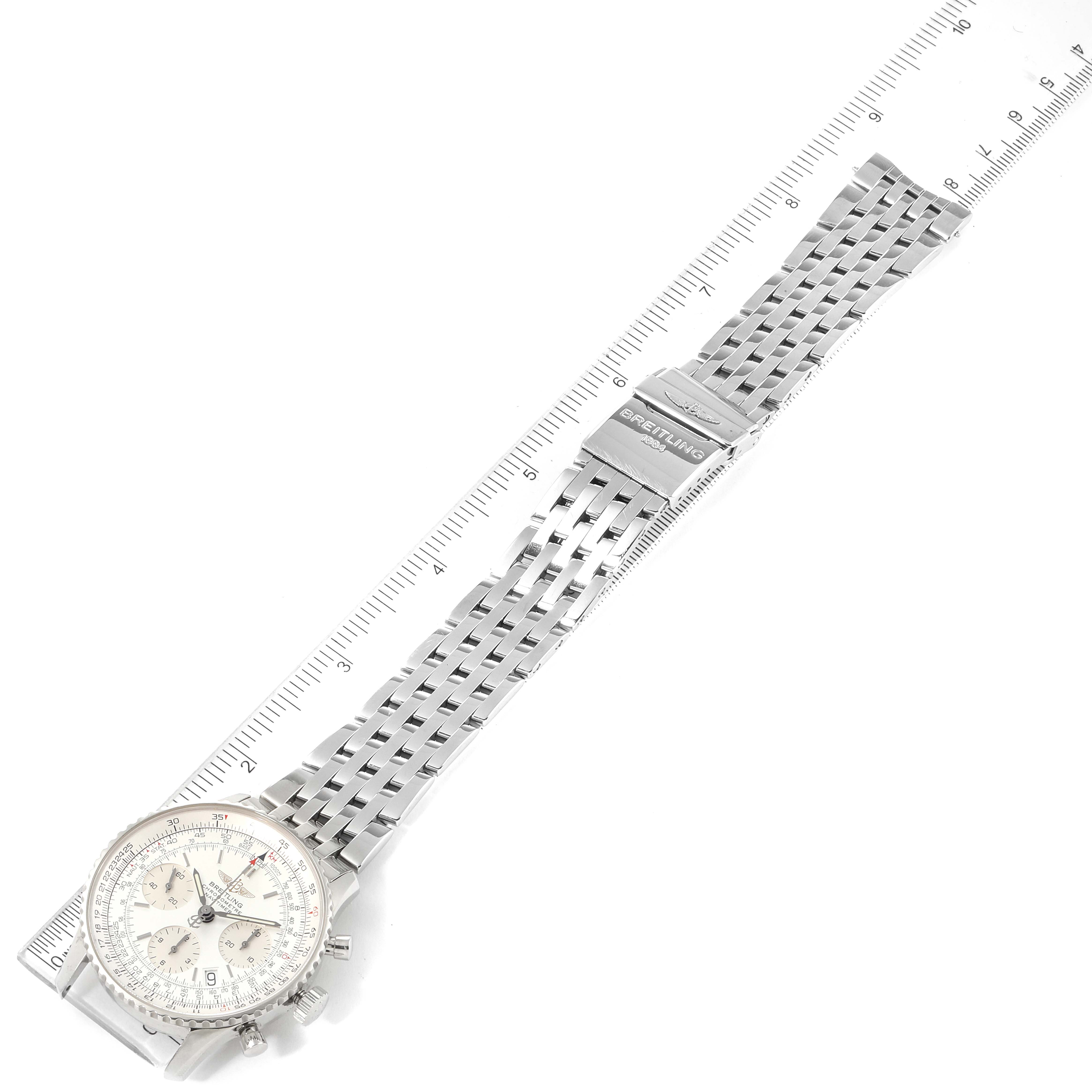 The image shows a Breitling Navitimer A23322 Men's Stainless Steel Silver Dial A23322 Men's Stainless Steel Silver Dial watch at a straight angle, displaying the face, bracelet, and clasp against a ruler for scale.