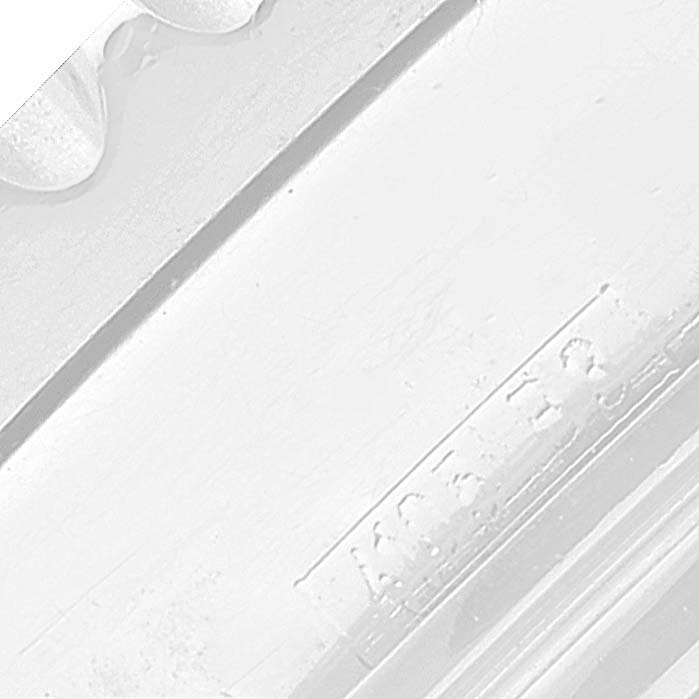 This close-up image of the Breitling Navitimer A23322 Men's Stainless Steel Silver Dial A23322 Men's Stainless Steel Silver Dial watch displays a partial view of its band and clasp.