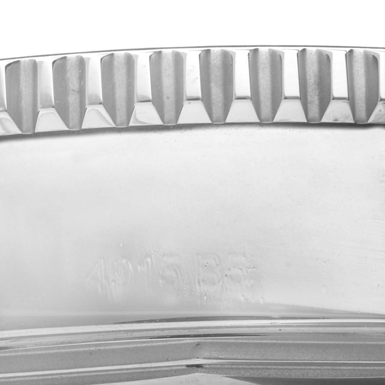 This close-up image shows the bezel edge and part of the case of a Breitling Superocean A17365 Men's Stainless Steel Blue Dial A17365 Men's Stainless Steel Blue Dial watch.