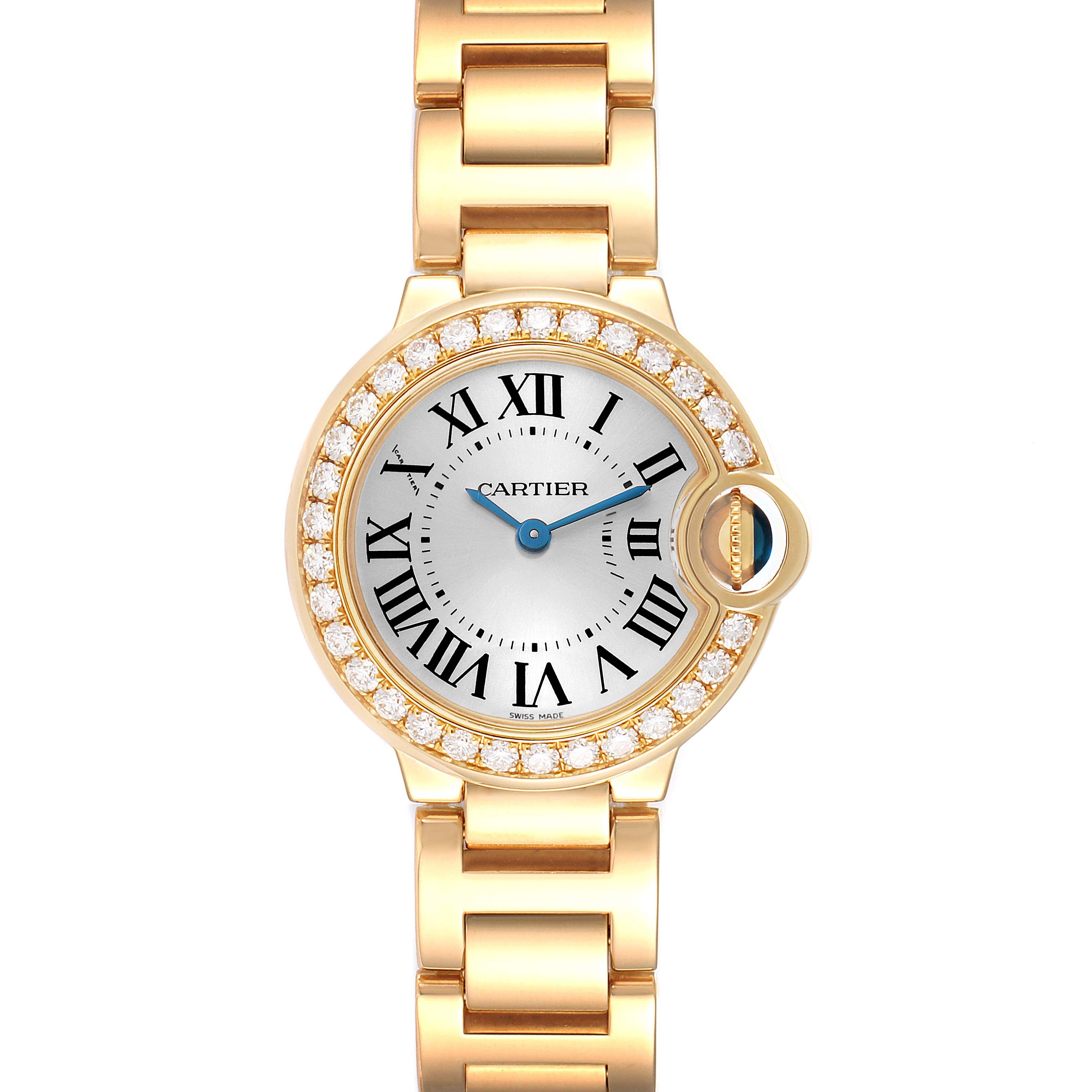 The image shows a frontal view of the Cartier Ballon Bleu WE9001Z3 Women's Yellow Gold Silver Dial WE9001Z3 Women's Yellow Gold Silver Dial watch, highlighting its face, bezel with diamonds, and part of its gold strap.