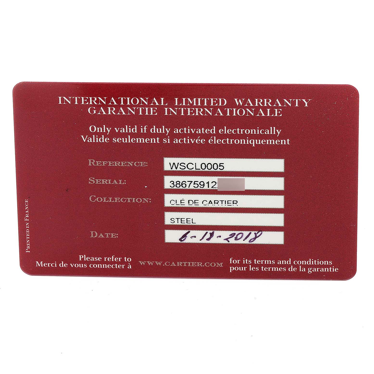 This image shows the international limited warranty card for a Cartier Clé model watch.