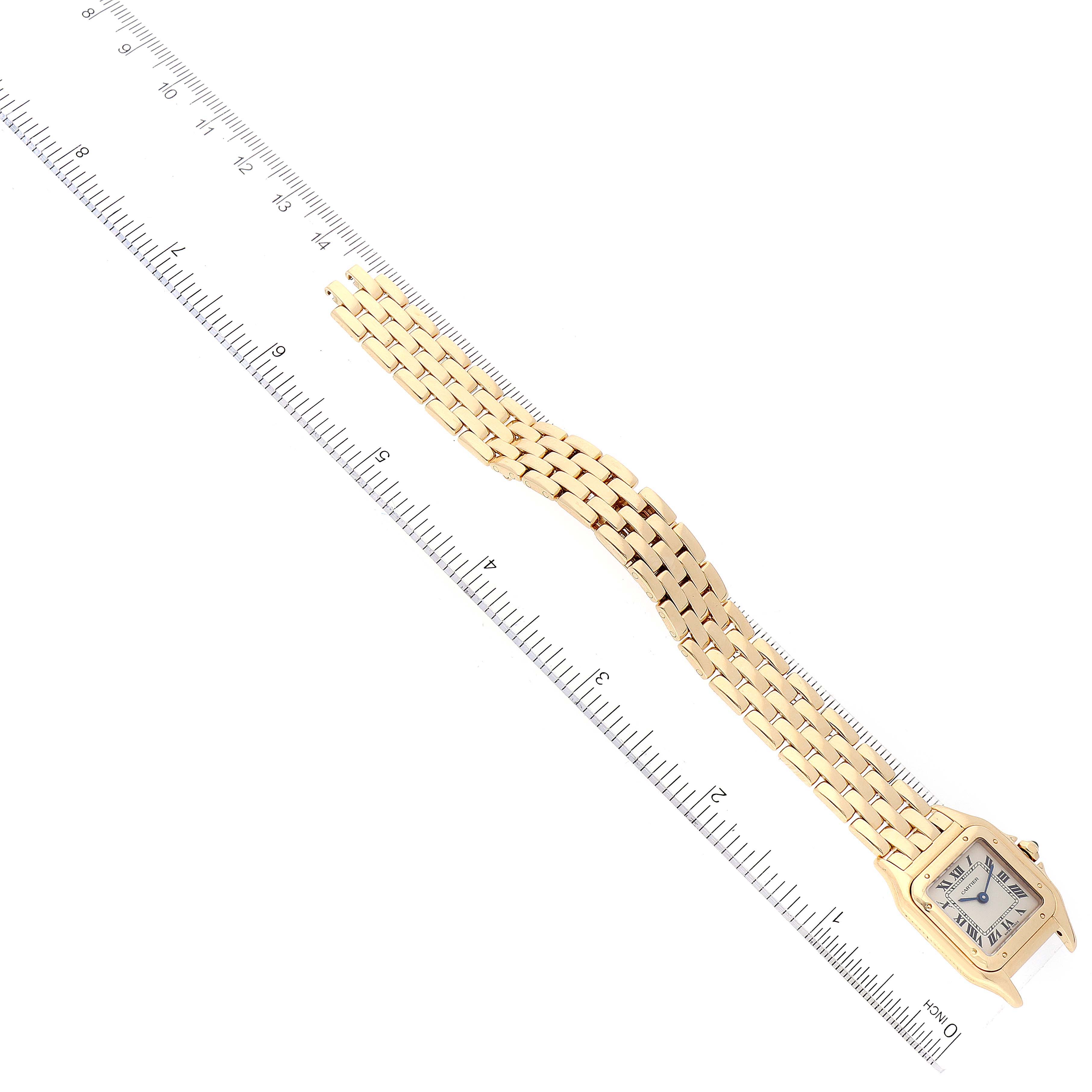 The image shows the Panthere de Cartier watch laid flat with a ruler beside it for scale.