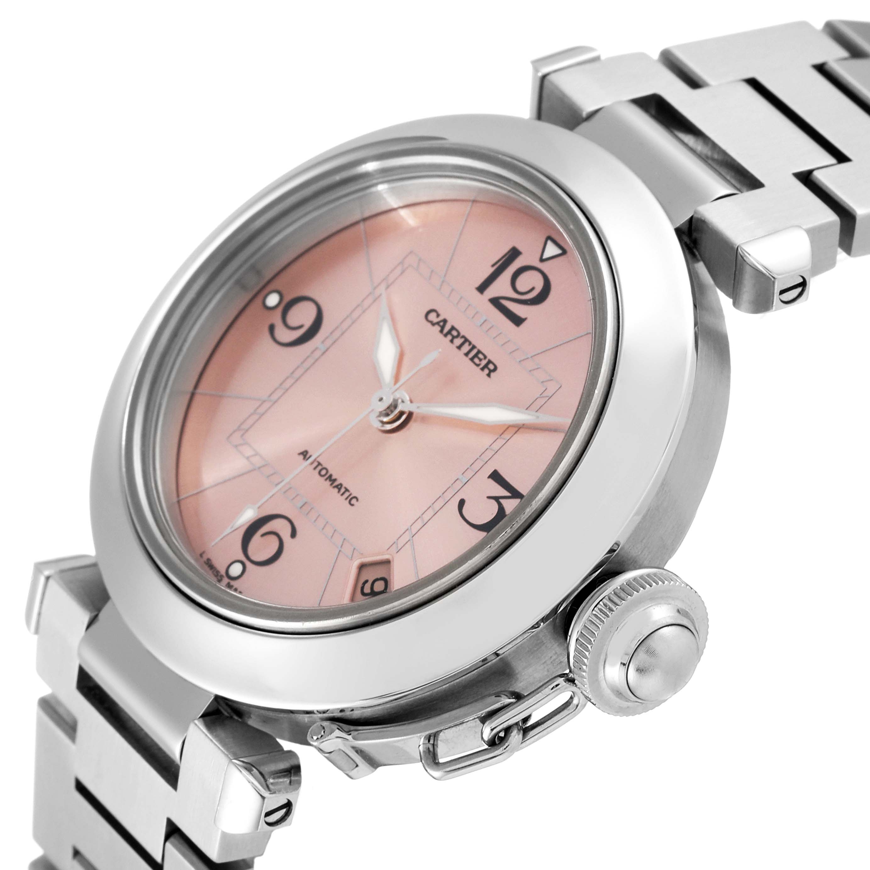This image shows a close-up angle of the Cartier Pasha W31075M7 Women's Stainless Steel Pink Dial W31075M7 Women's Stainless Steel Pink Dial watch, highlighting the pink dial, crown, and metal bracelet.