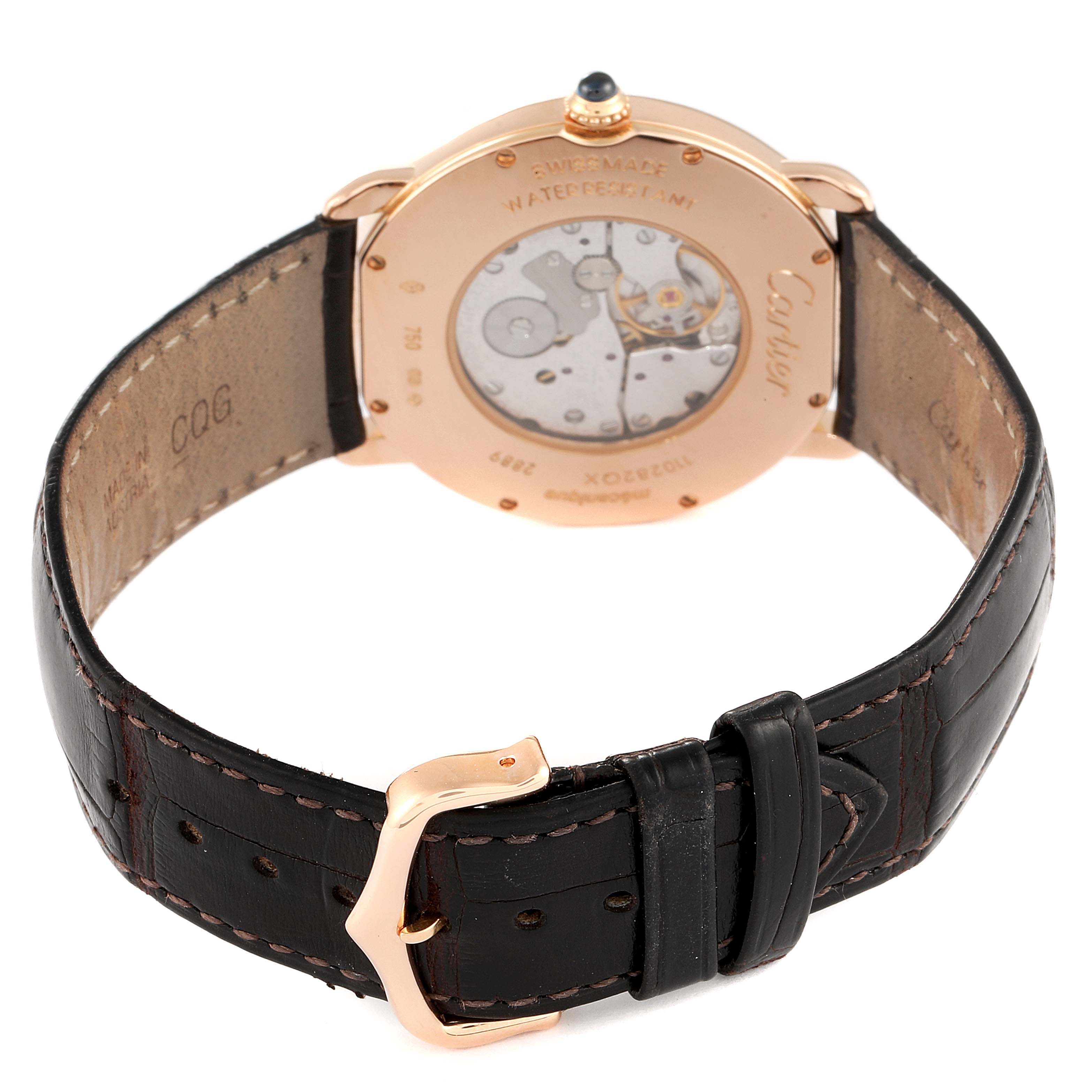 This image shows the back view of a Cartier Ronde W6800251 Men's Rose Gold Silver Dial W6800251 Men's Rose Gold Silver Dial watch, including its case back, movement, and leather strap with a buckle.