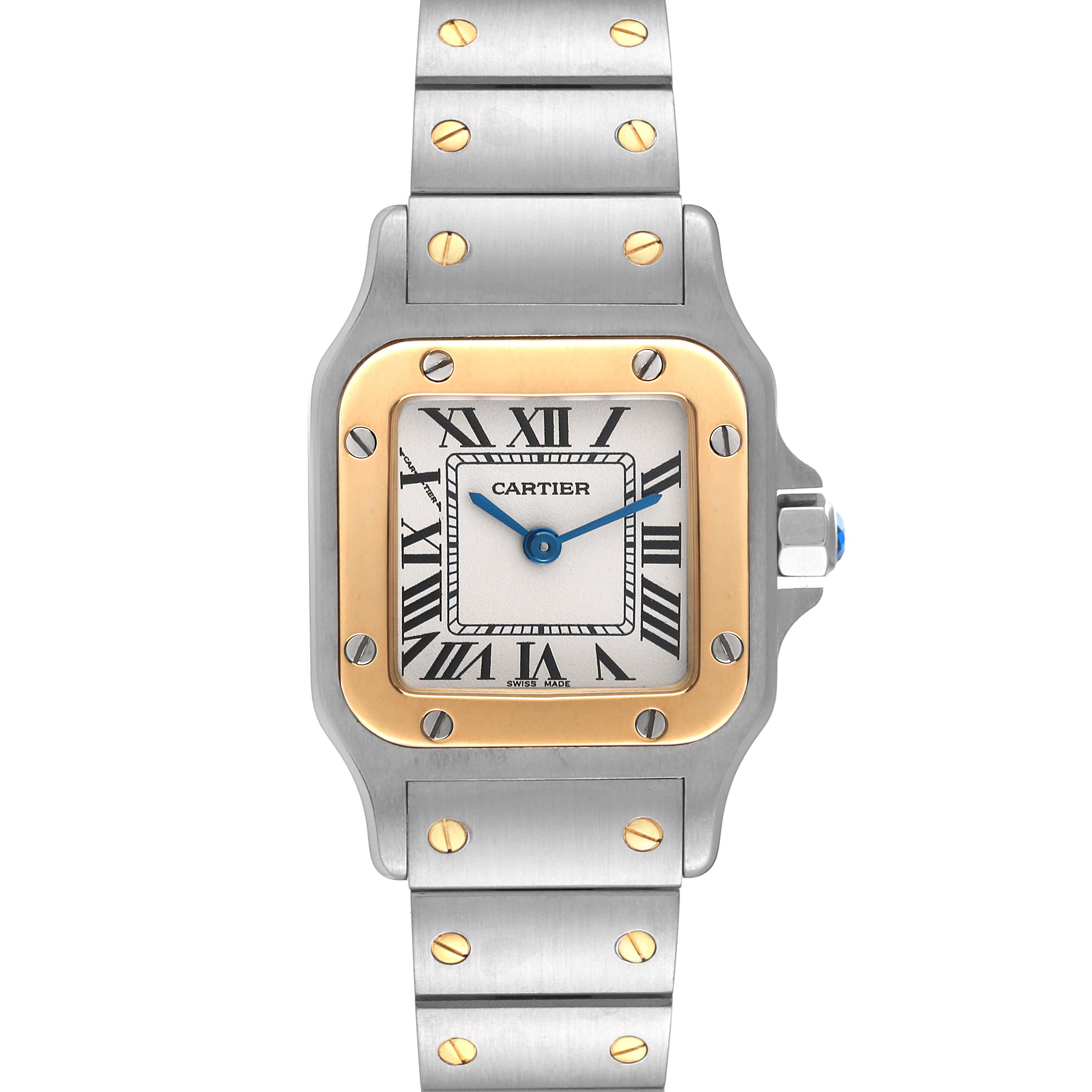 The image shows a front view of a Cartier Santos W20012C4 Women's Steel and Gold (two tone) Silver Dial W20012C4 Women's Steel and Gold (two tone) Silver Dial watch, highlighting its square dial, Roman numerals, and two-tone metal band.