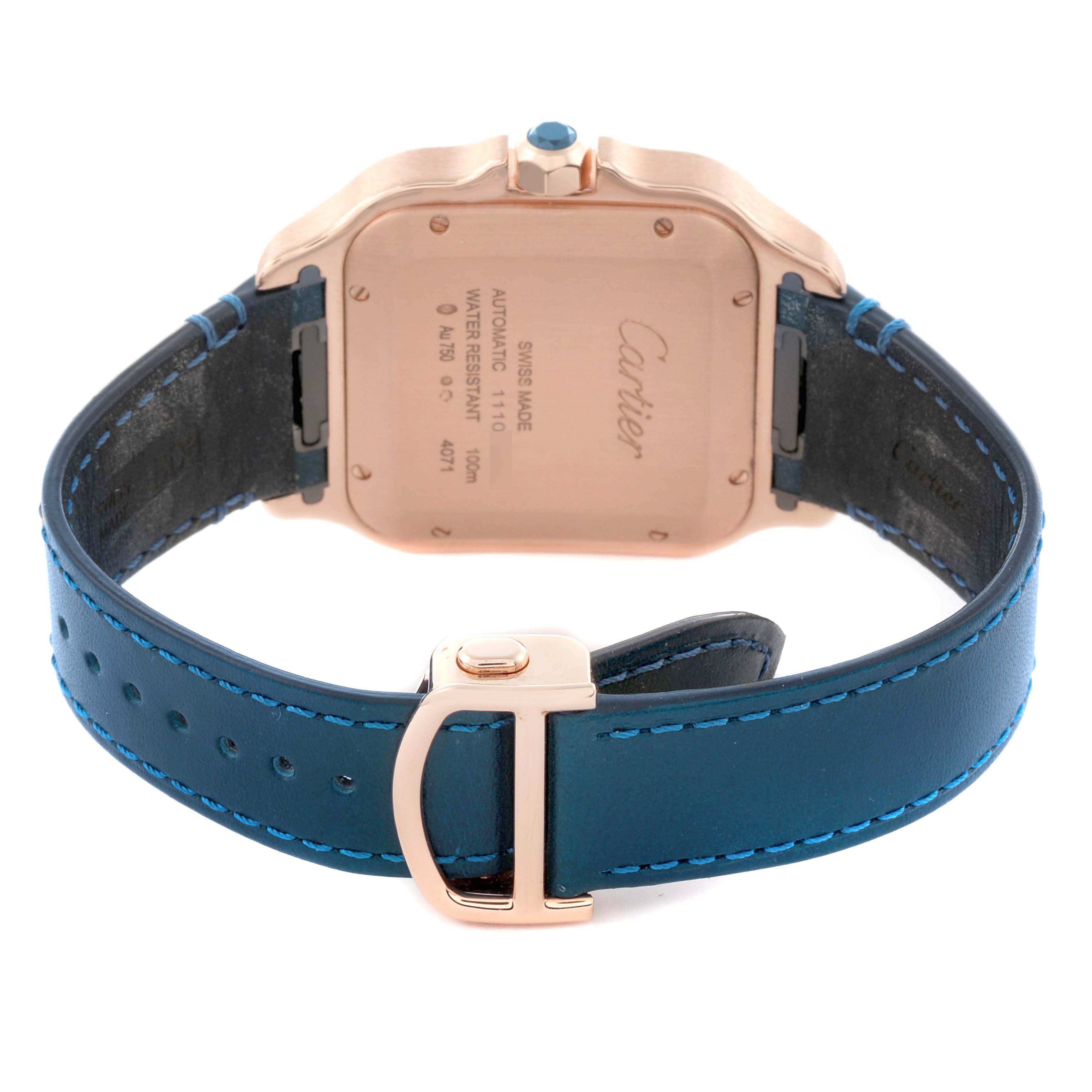 The image shows the back of a Cartier Santos WGSA0019 Men's Rose Gold Silver Dial WGSA0019 Men's Rose Gold Silver Dial watch, highlighting the case back and blue leather strap.