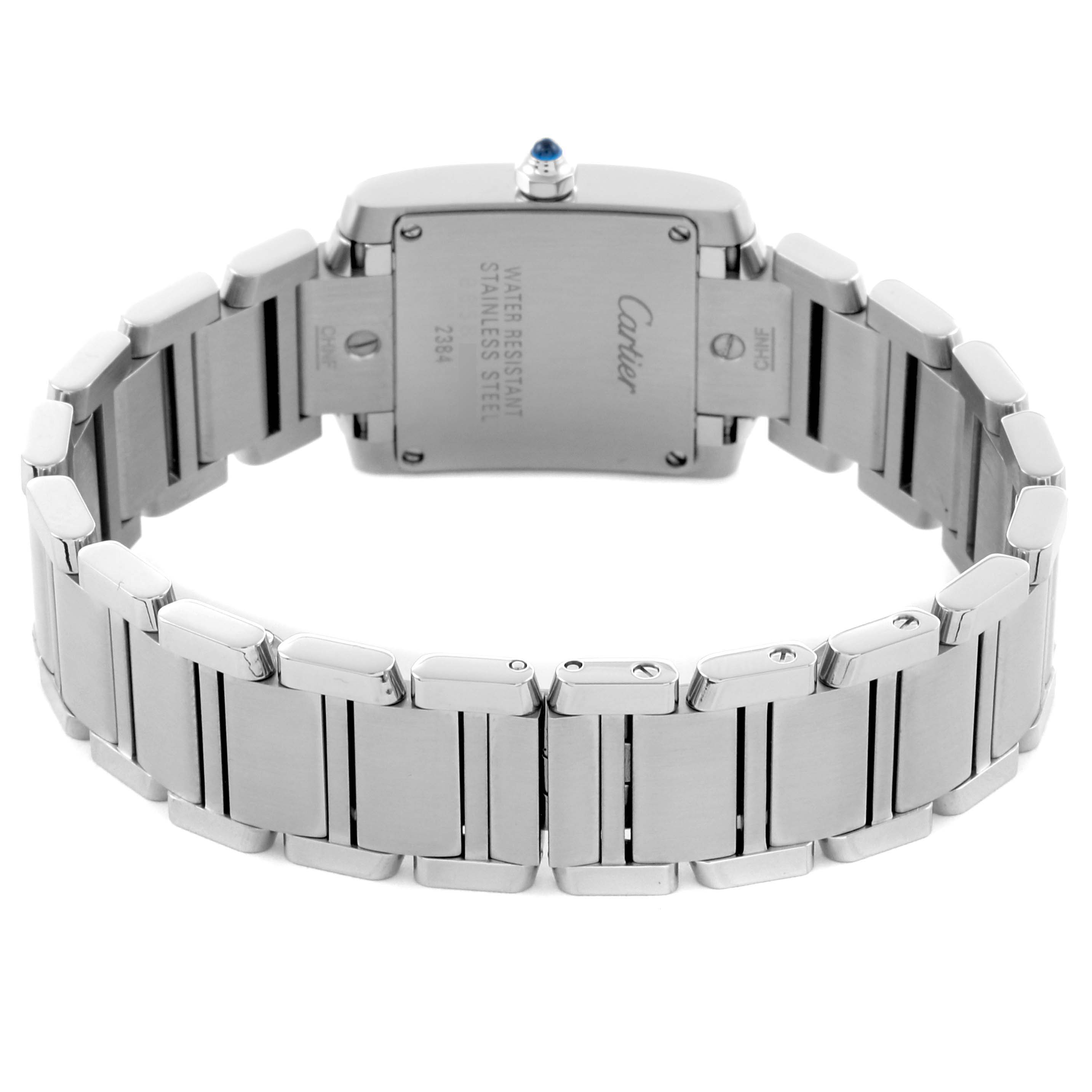The Cartier Tank Française watch is shown from the back, highlighting the stainless steel bracelet and case back.