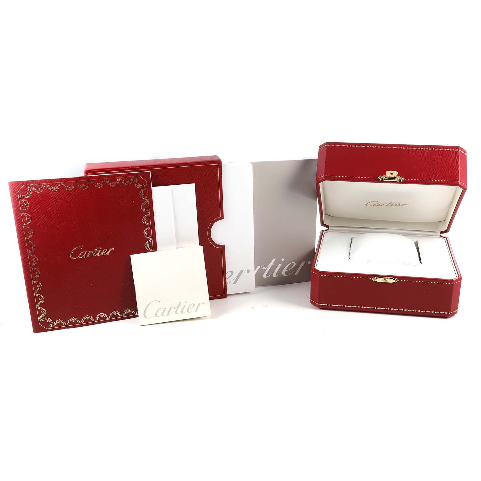 This image shows the packaging and accessories, including the box and manuals, for a Cartier Tank Française watch.