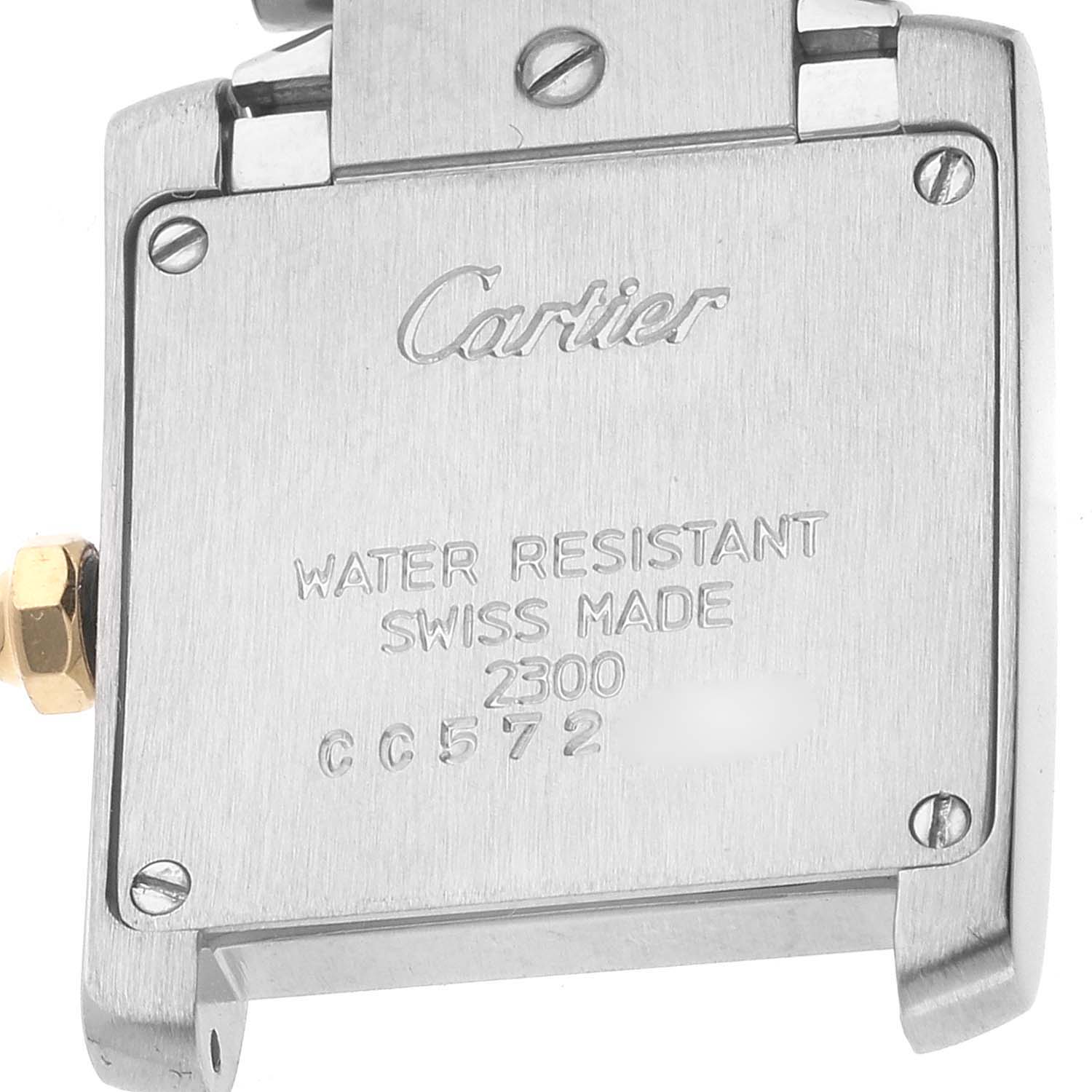 The image shows the back of a Cartier Tank Française watch, highlighting the brand engraving and model information.