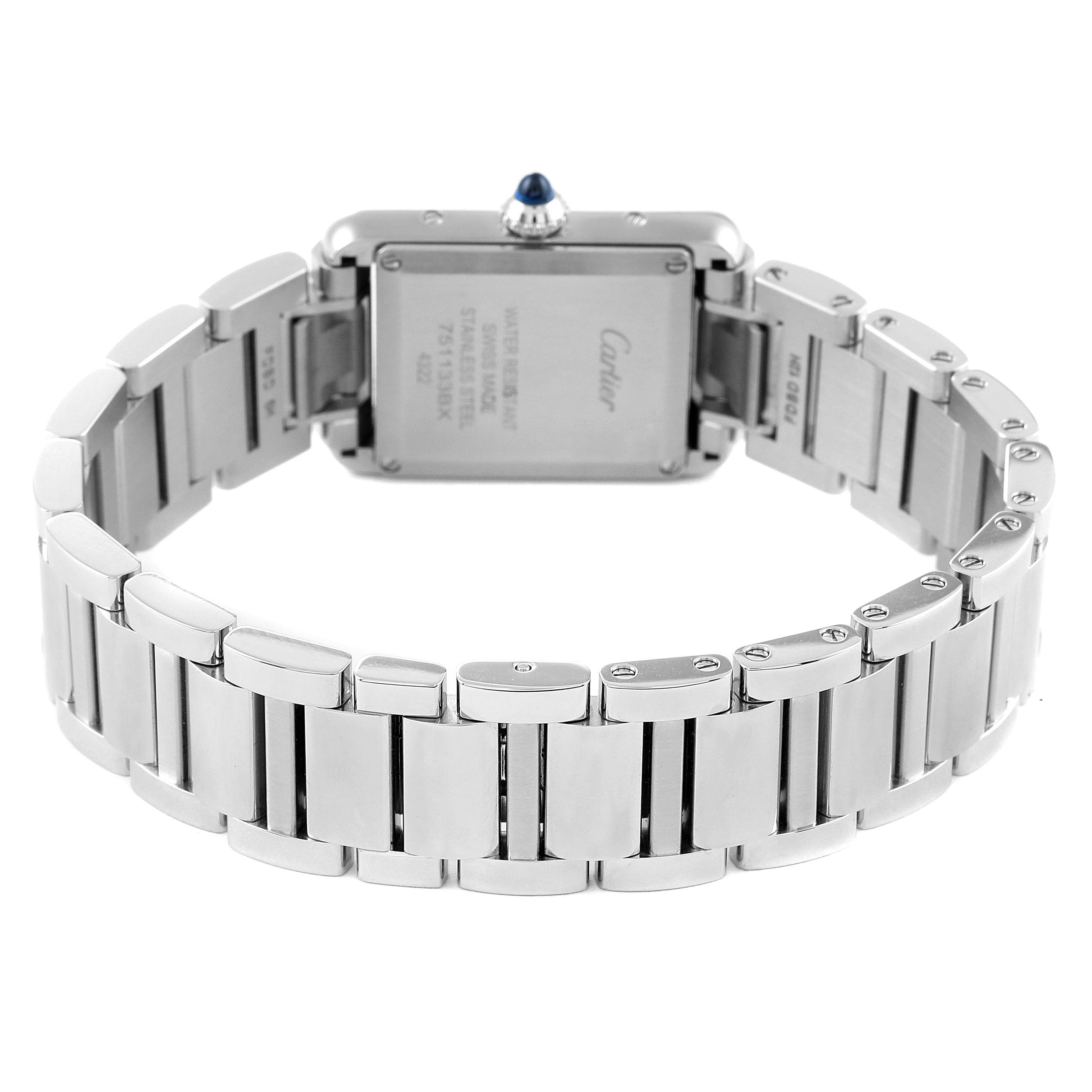 The image shows the back angle of the Cartier Tank Must WSTA0051 Women's Stainless Steel Silver Dial WSTA0051 Women's Stainless Steel Silver Dial watch, including the case back and part of the metal bracelet.