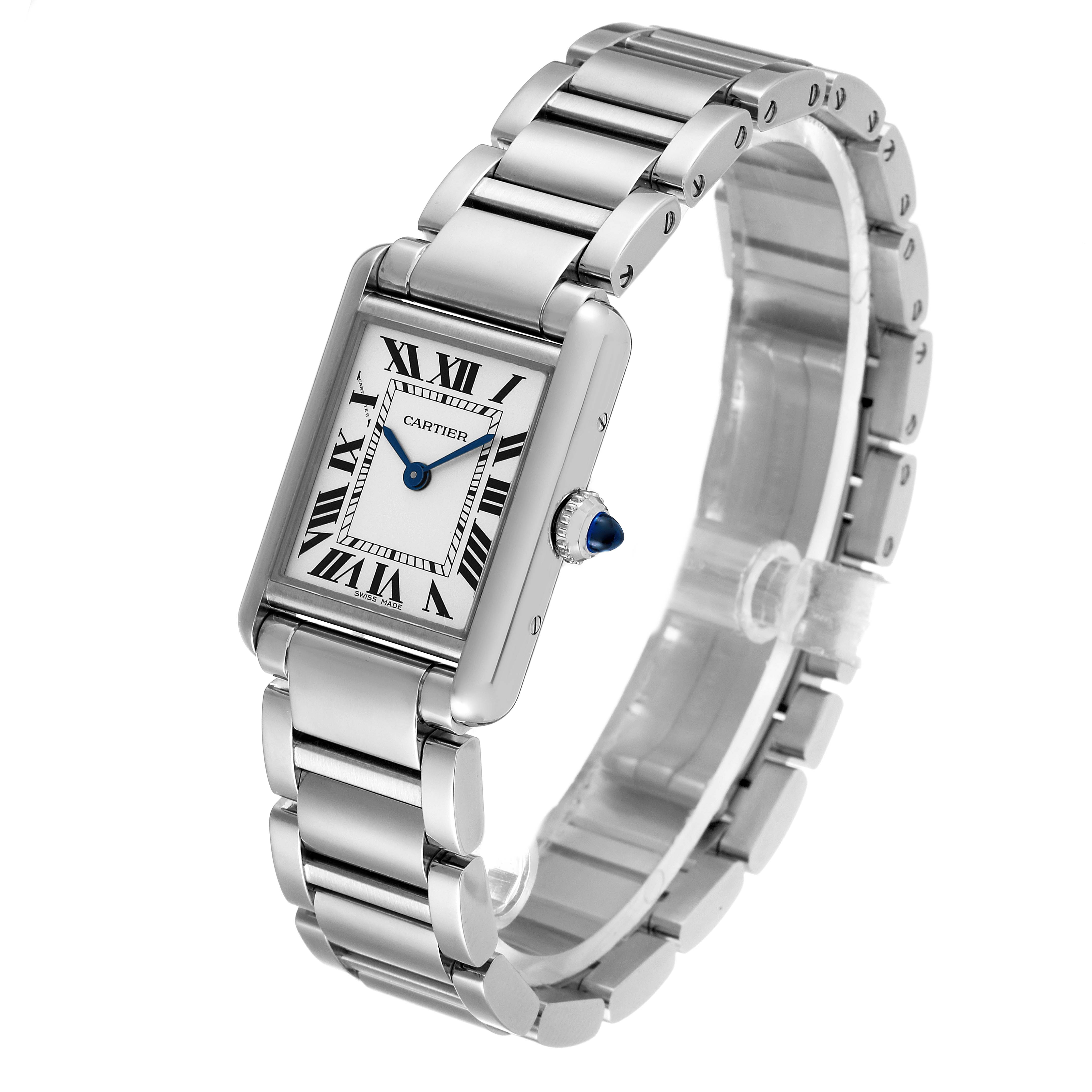 The image shows a Tank Must Cartier watch, angled to display the watch face and metal bracelet.
