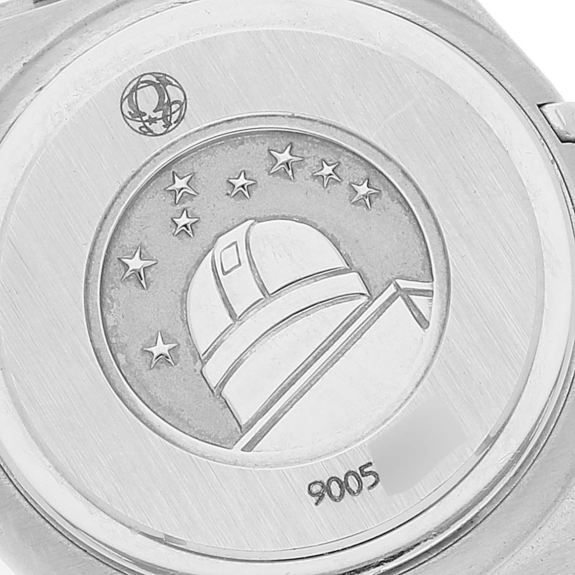 This image shows the back of the Omega 1460.79.00 Women's Stainless Steel Mother of Pearl Dial 1460.79.00 Women's Stainless Steel Mother of Pearl Dial Constellation Iris Steel Multi Stone Ladies Watch, model 1460.79.00 with an engraved observatory.
