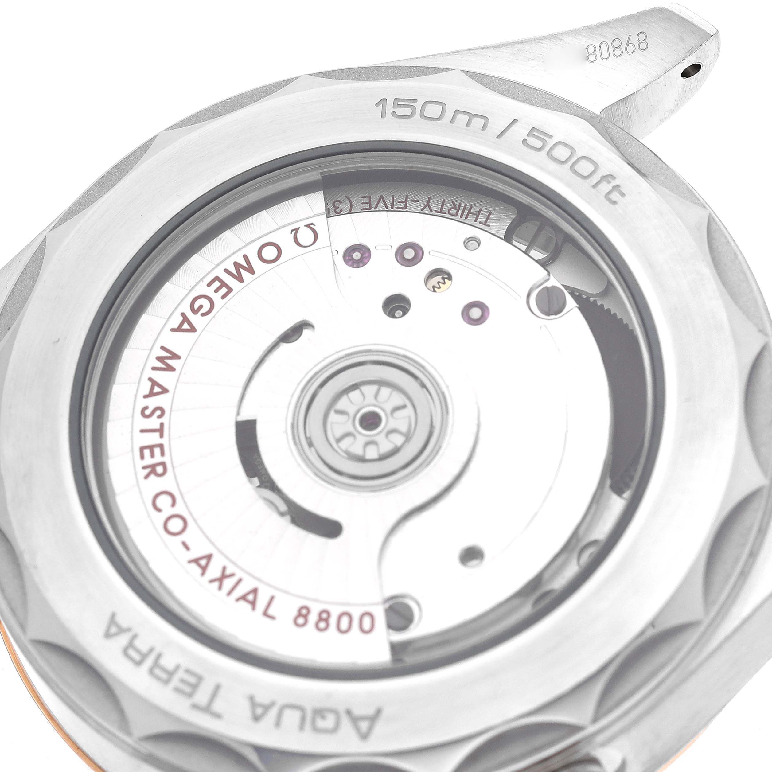 The image shows the caseback of the Omega Aqua Terra 220.22.38.20.02.001 Men's Steel and Gold (two tone) Silver Dial 220.22.38.20.02.001 Men's Steel and Gold (two tone) Silver Dial watch, revealing the Co-Axial 8800 movement inside.