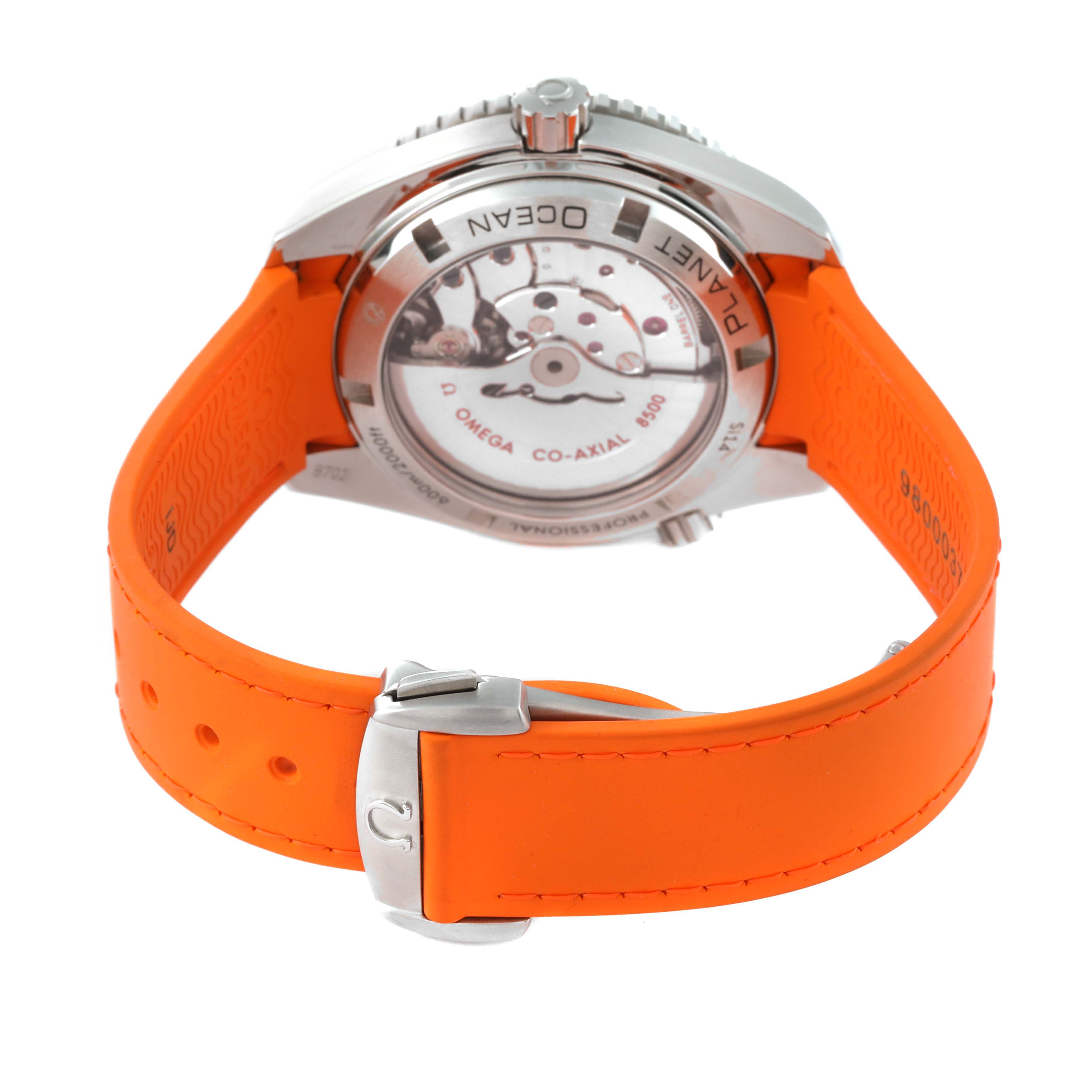 The image shows the back case and orange strap of the Omega Planet Ocean 232.32.42.21.01.001 Men
s Stainless Steel Black Dial 232.32.42.21.01.001 Men
s Stainless Steel Black Dial watch, highlighting the movement mechanism.