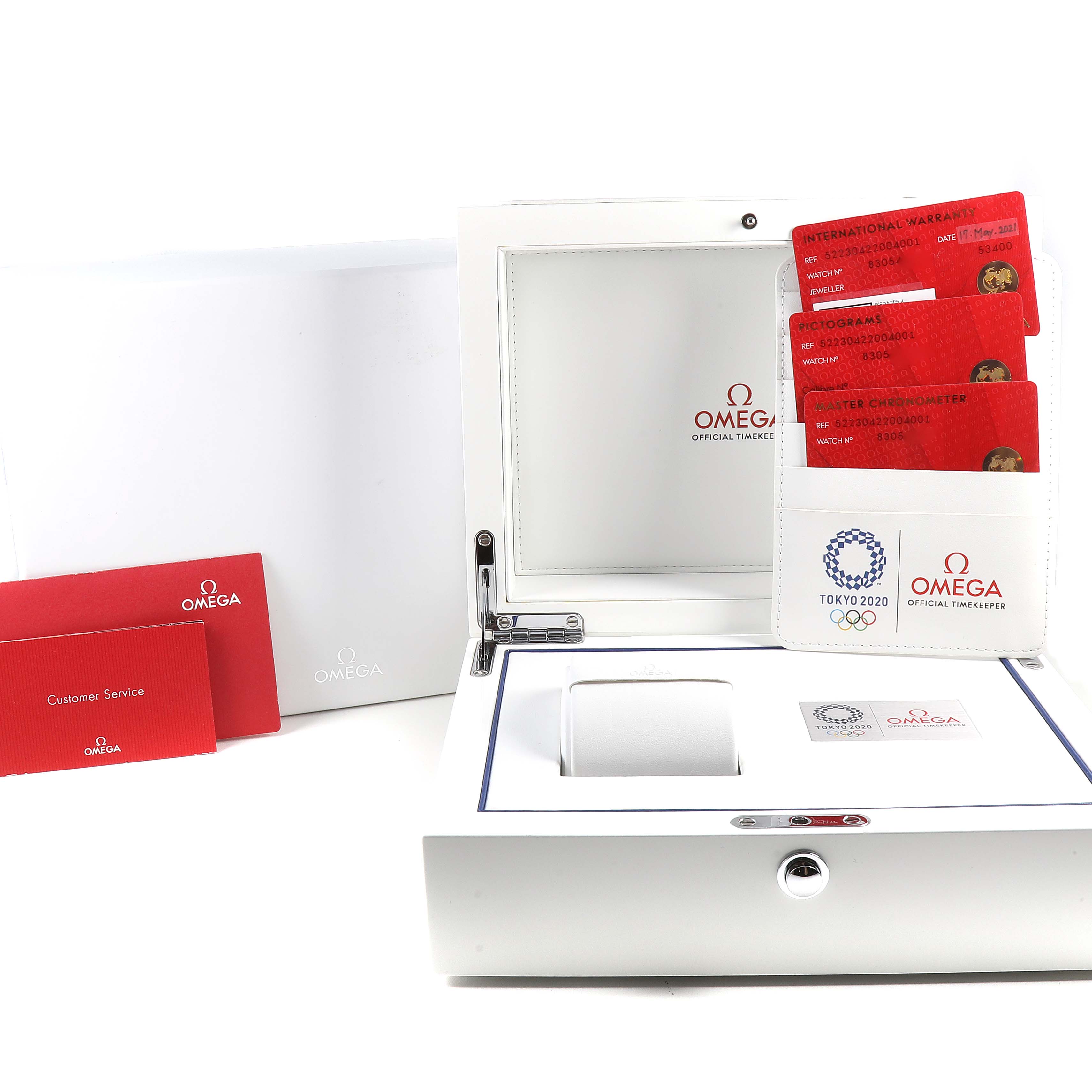 The image shows an Omega Seamaster 522.30.42.20.04.001 Men's Stainless Steel White Dial 522.30.42.20.04.001 Men's Stainless Steel White Dial watch box and packaging, including warranty cards and a customer service booklet.