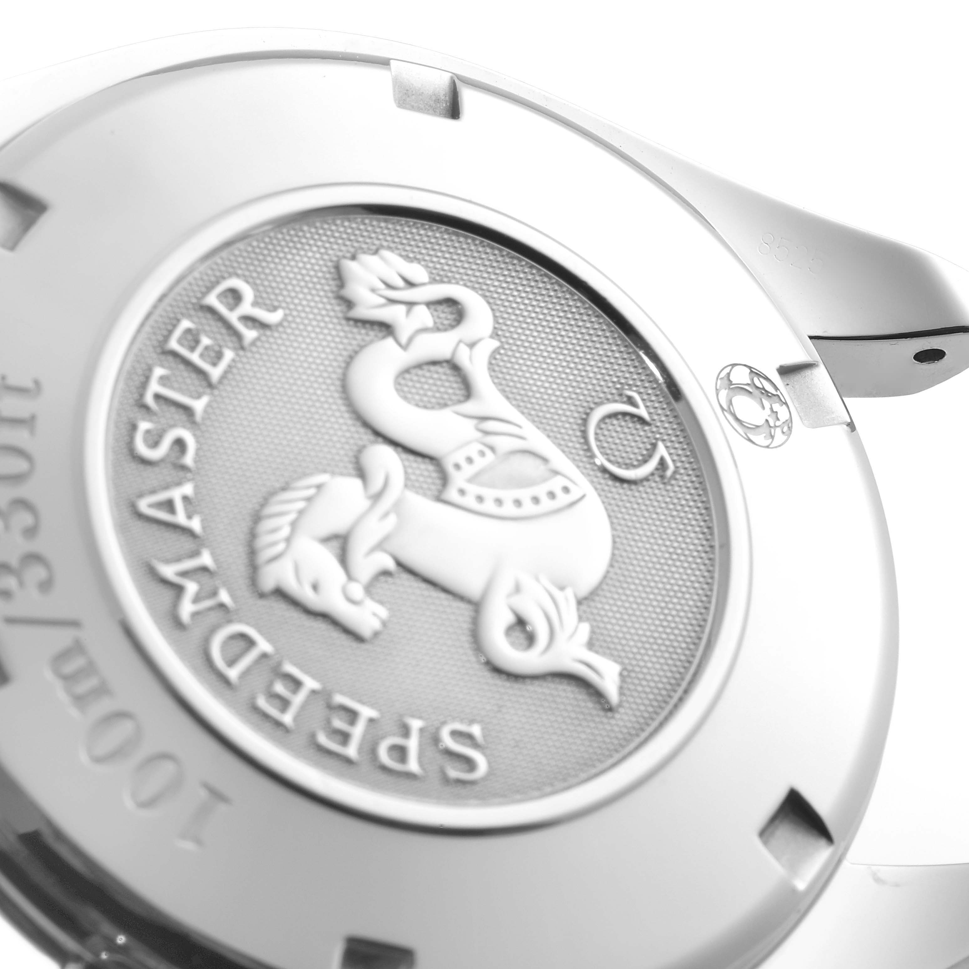 The image shows the back case of an Omega Speedmaster 323.10.40.40.02.001 Men's Stainless Steel Silver Dial 323.10.40.40.02.001 Men's Stainless Steel Silver Dial watch, highlighting the engraved emblem and text.