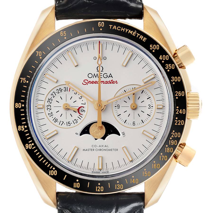 The Omega Speedmaster watch is shown from the front, highlighting the dial, subdials, hands, and tachymeter bezel.