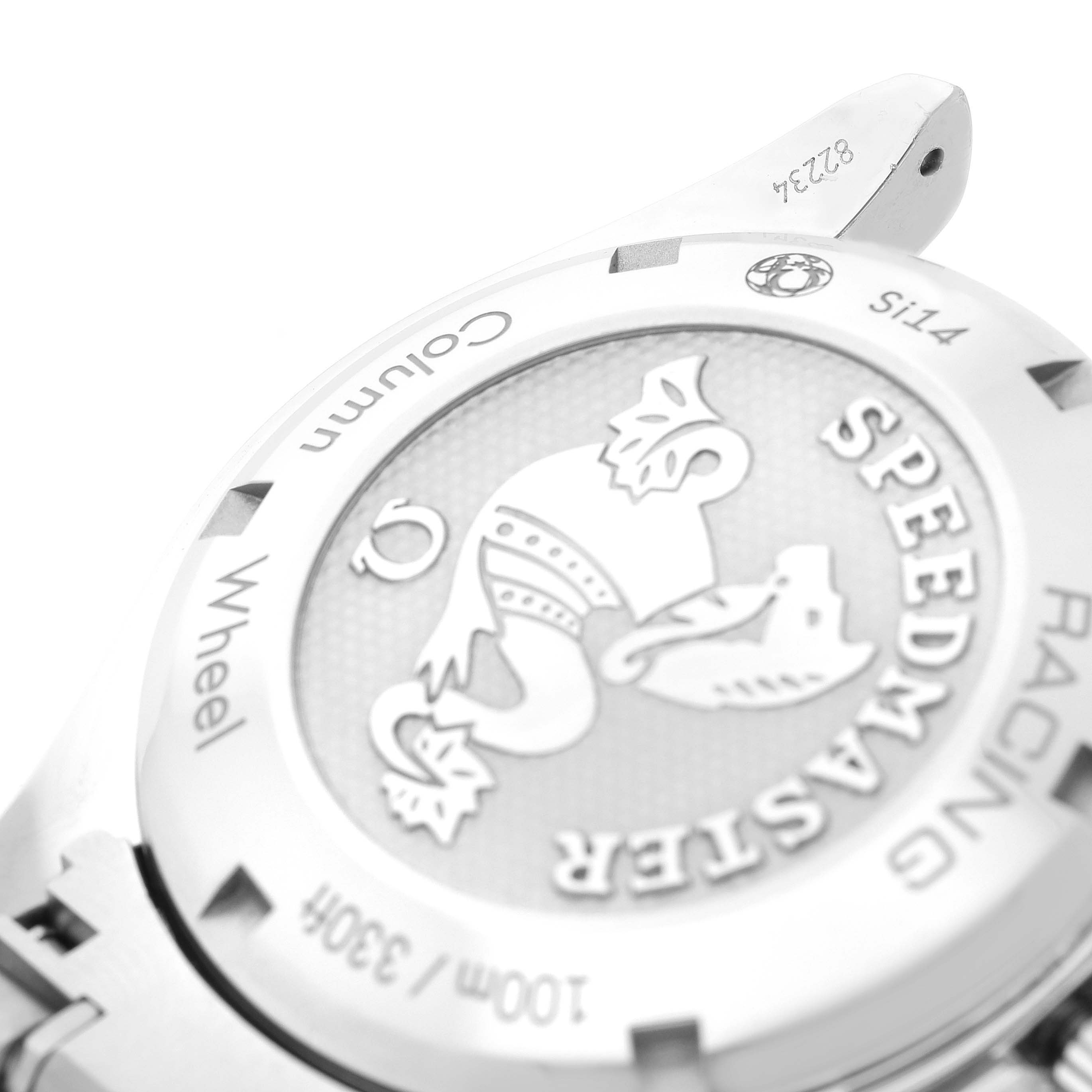 The image shows a close-up of the case back of an Omega Speedmaster 326.30.40.50.03.001 Men
s Stainless Steel Blue Dial 326.30.40.50.03.001 Men
s Stainless Steel Blue Dial watch, highlighting the engraved details.