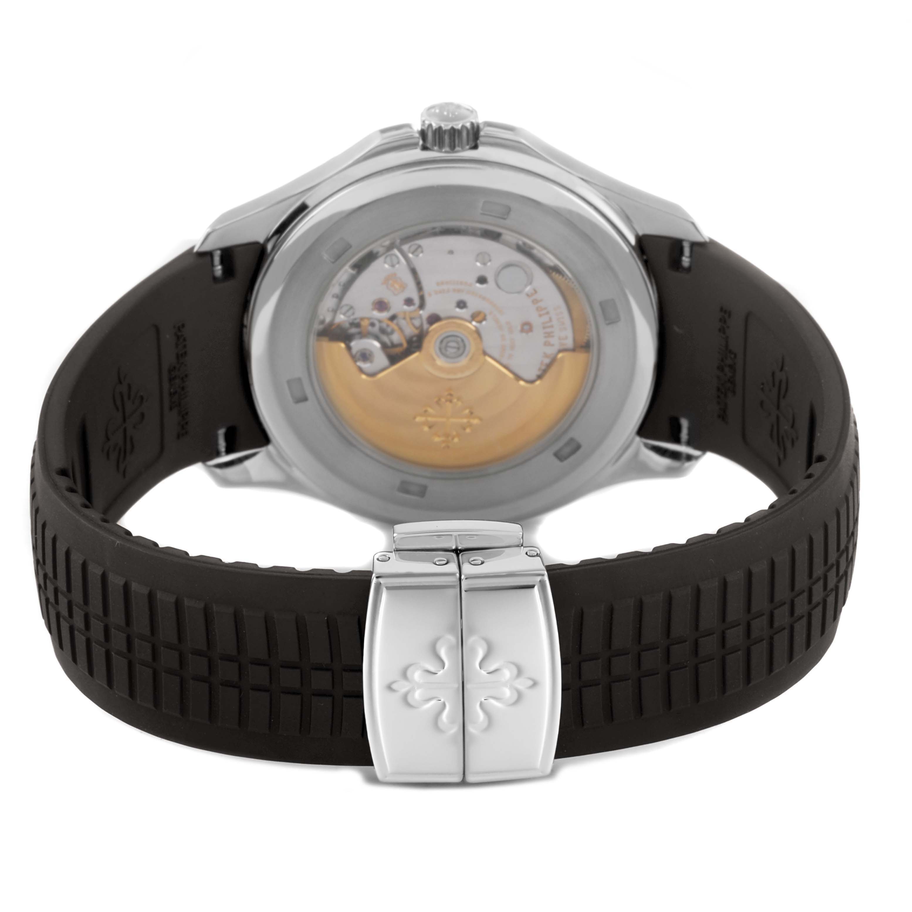 The image shows the back view of the Patek Philippe Aquanaut 5167A Men's Stainless Steel Black Dial, highlighting the movement and rubber strap with clasp.